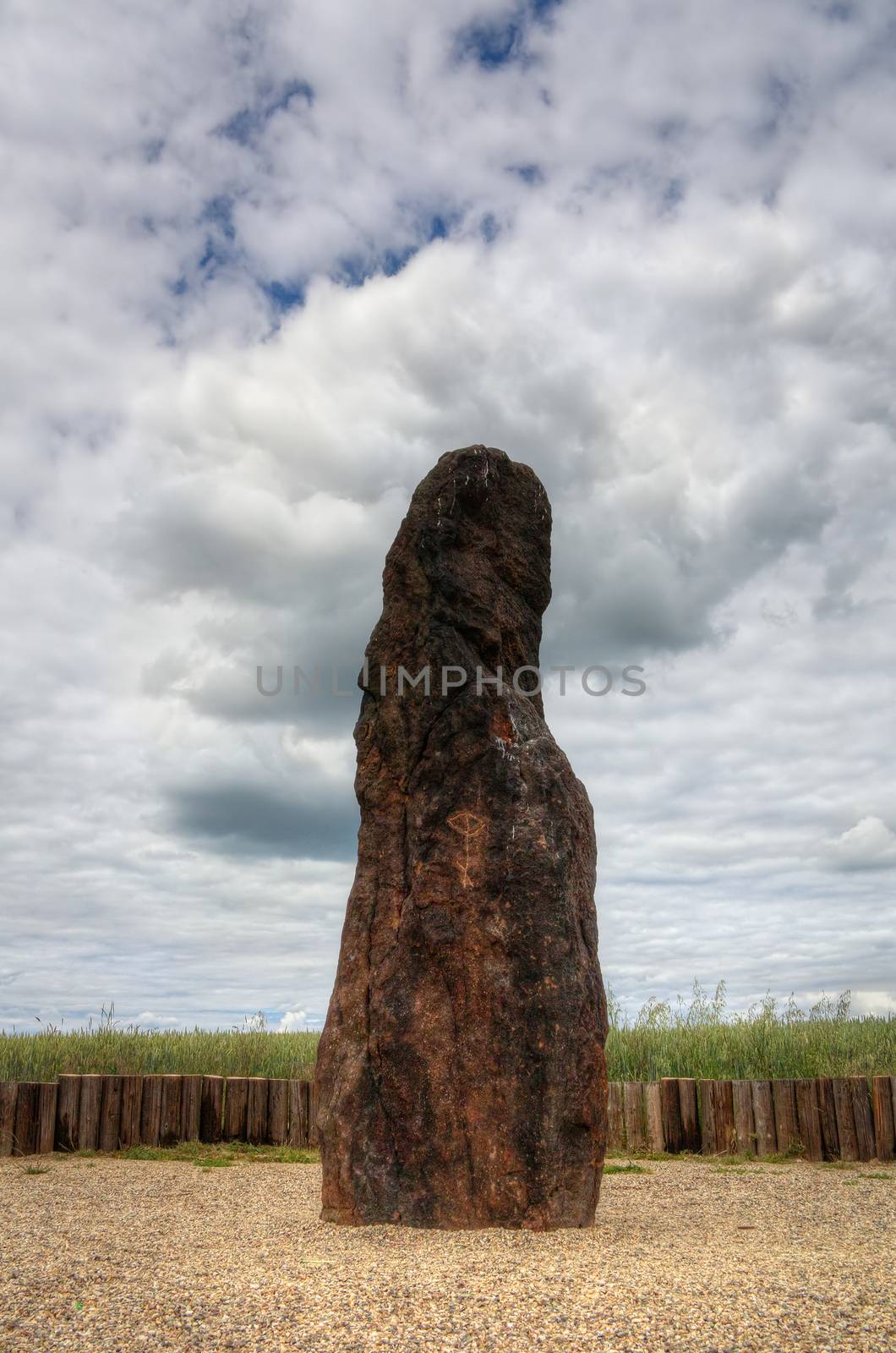 Menhir Stone Shepherd (also Stone Man, Petrified Man or Petrified minister) is a menhir standing alone in a field 1 km northwest of the village Klobuky, district Kladno. This is the highest menhir in the Czech Republic.  3.5 m tall columnar rock uncut dark iron Cretaceous sandstone. This is one of the few stones in the country, which we can with high probability be considered a real prehistoric menhir.