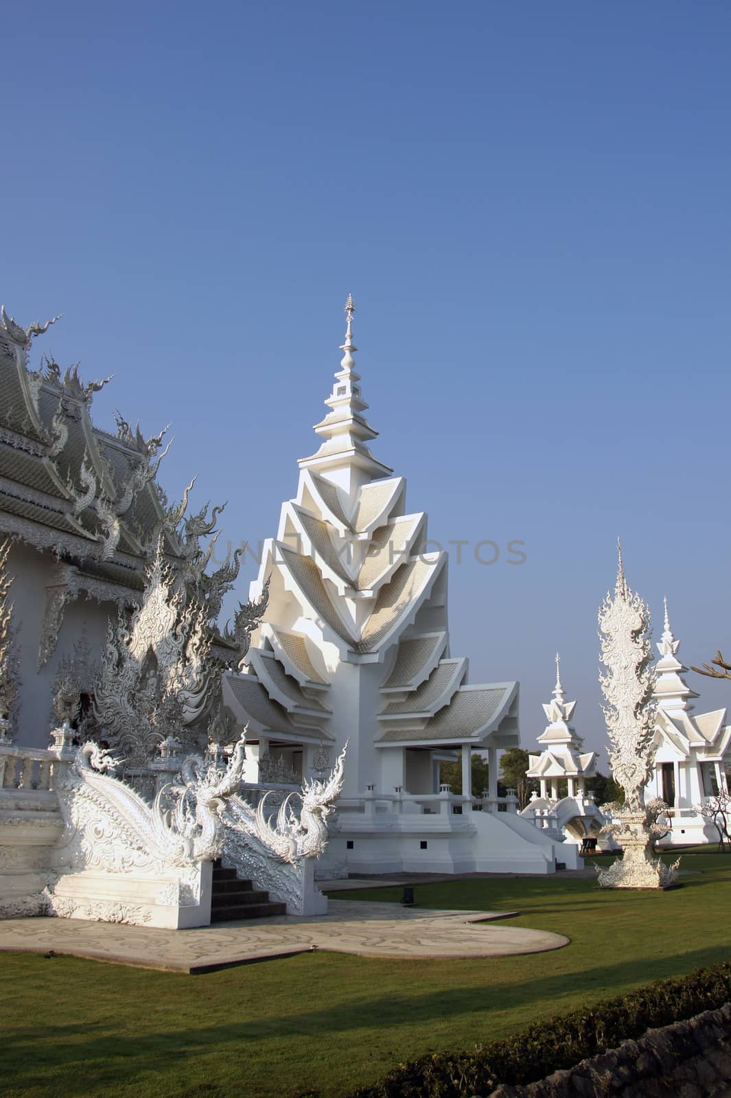 Modern Buddhist sculpture,. White temple in Thailand. by Noppharat_th