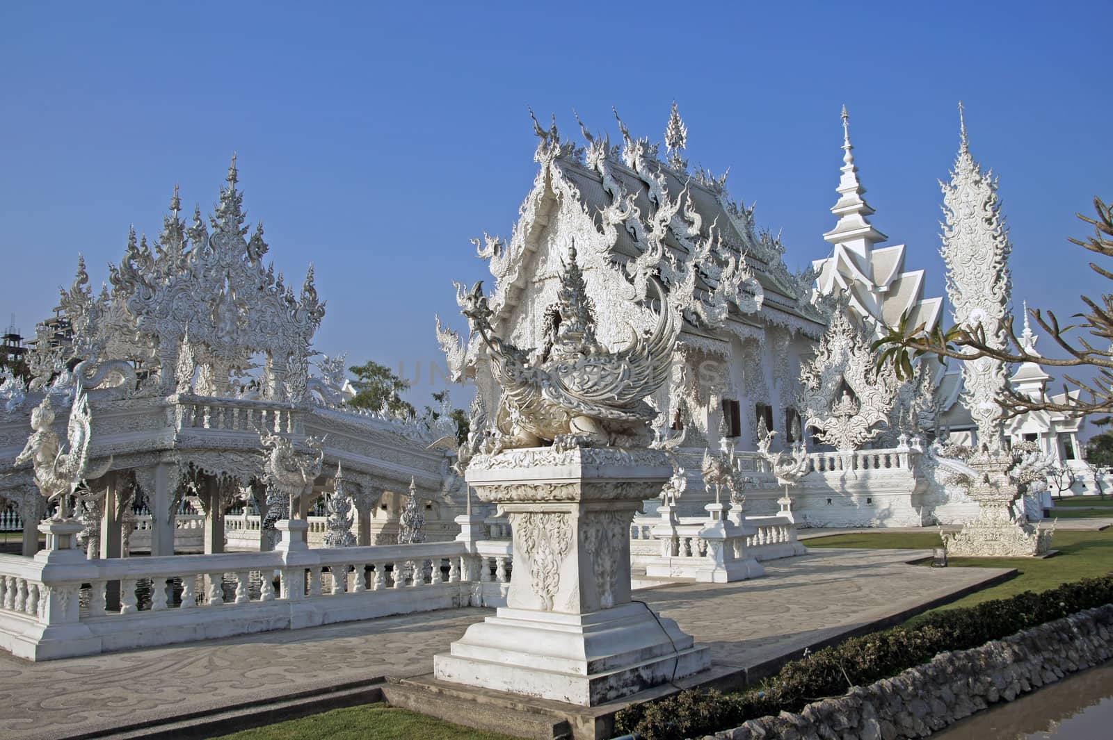 Modern Buddhist sculpture,. White temple in Thailand. by Noppharat_th