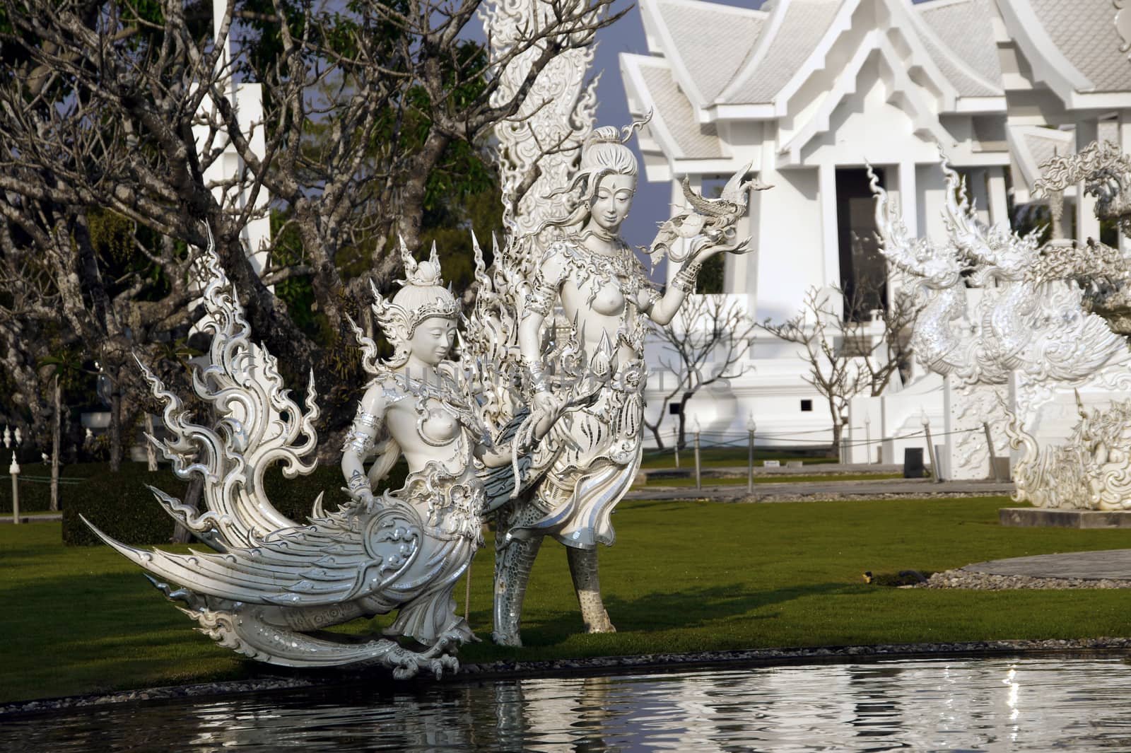 Modern Buddhist sculpture,.
White temple in Thailand. by Noppharat_th