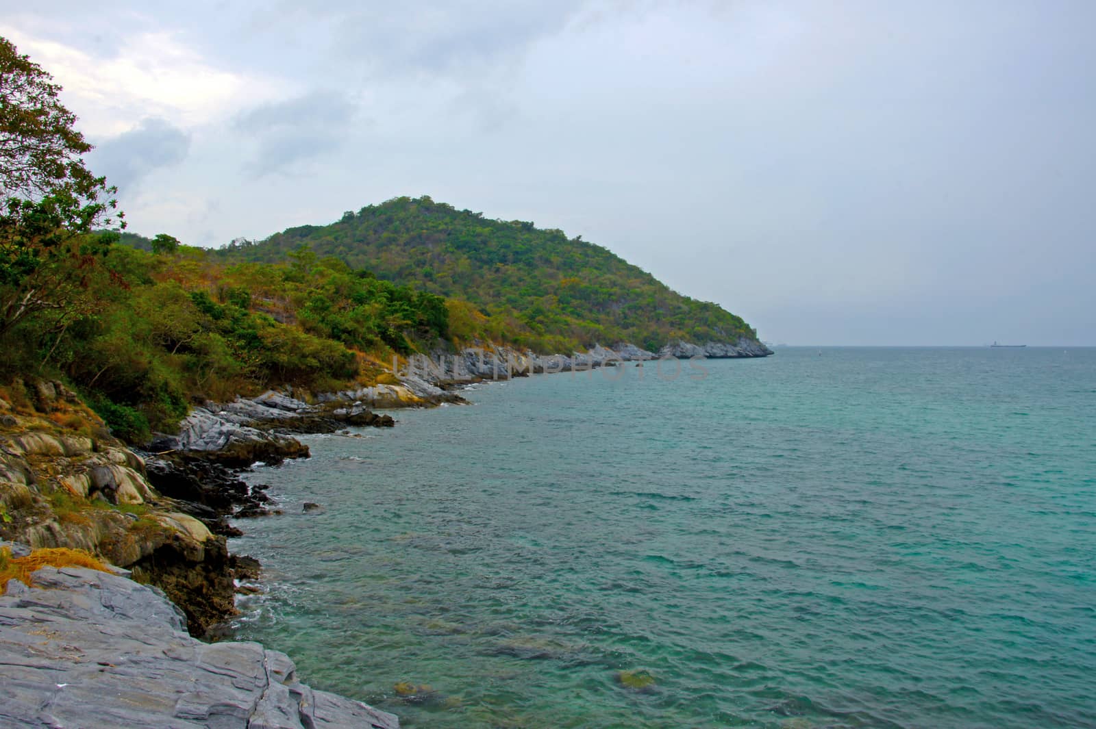 The seaside village on the island of Ko Si Chang ship at sea.