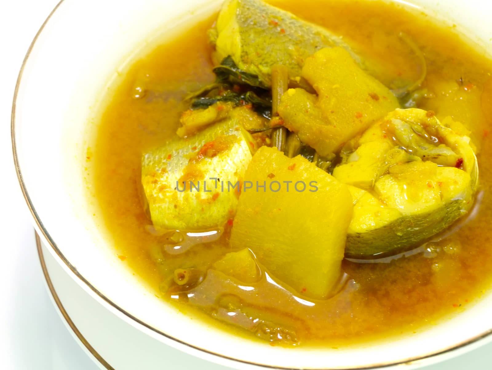 Yellow fish curry with pineapple.