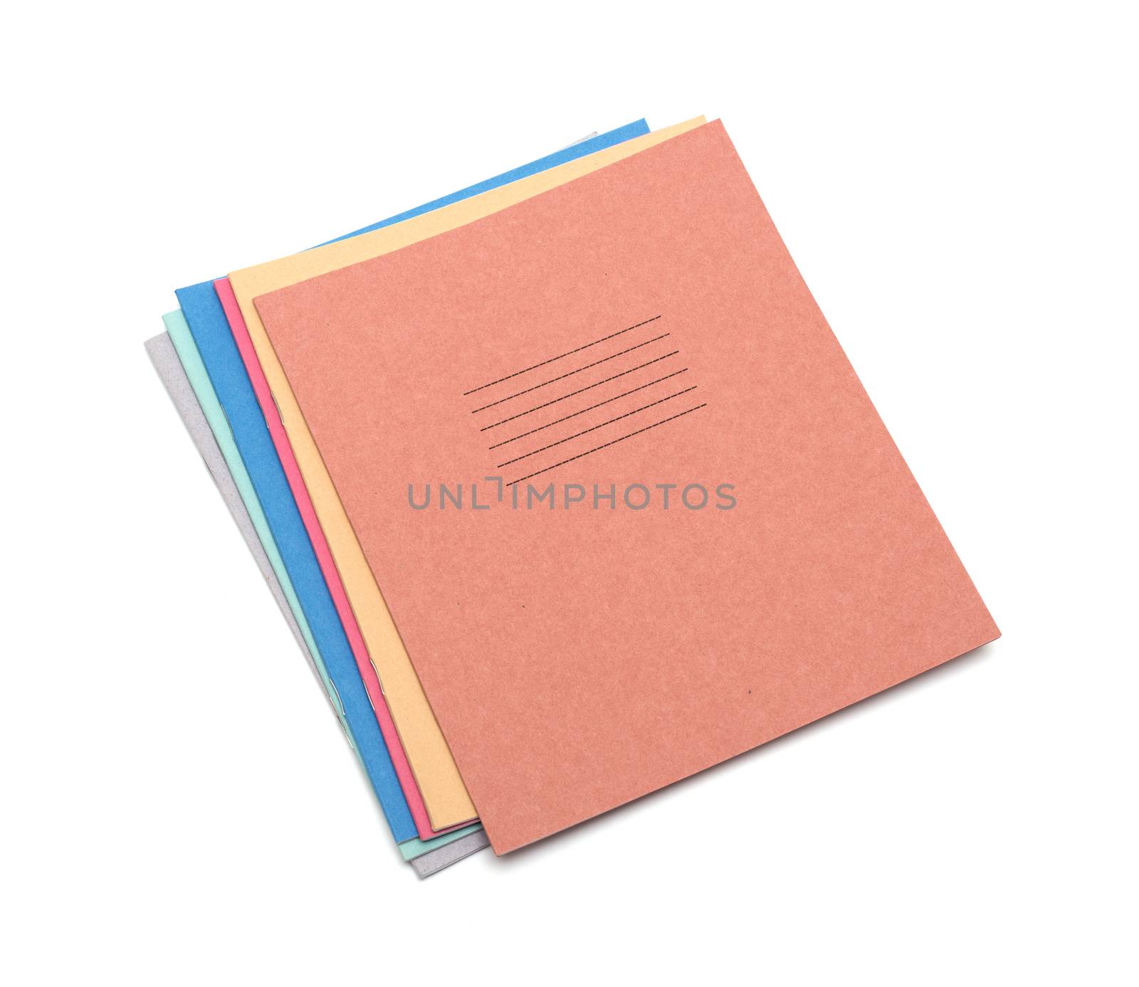 multicolored exercise books over the white background