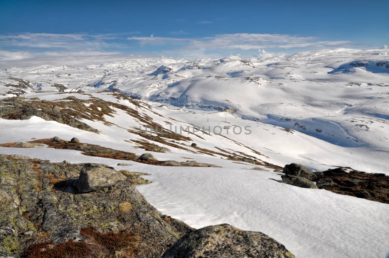 Panoramic view of snow-covered hills in the mountains near Trolltunga, Norway