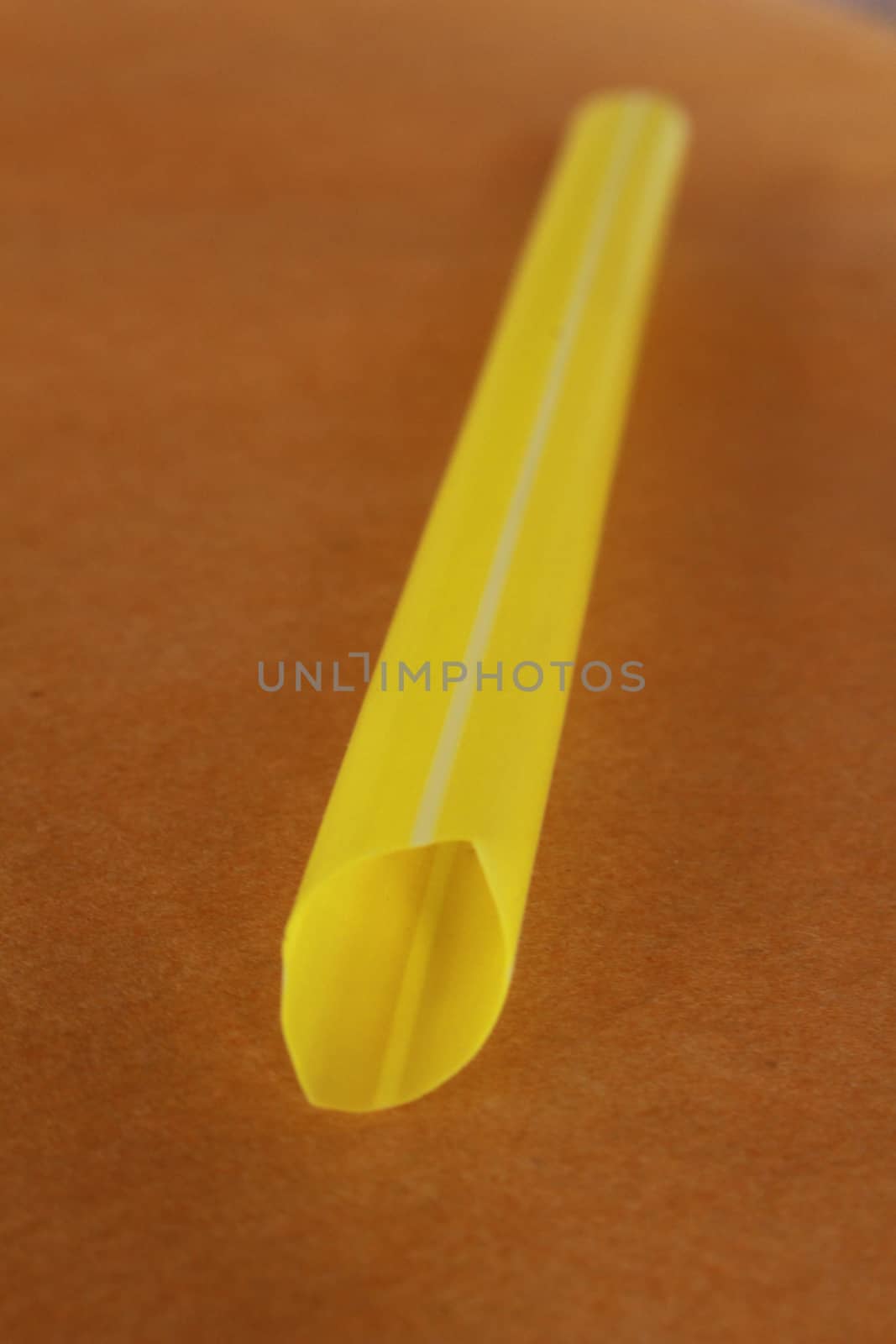 The yellow plastic straw use for drink or be the meterial for artwork.