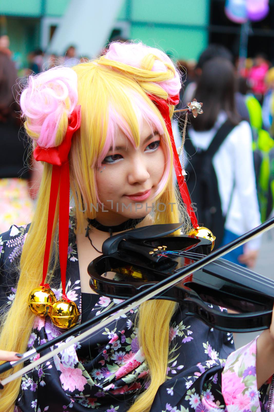 Bangkok - Aug 31: An unidentified Japanese anime cosplay pose  on August 31, 2014 at Central World, Bangkok, Thailand.