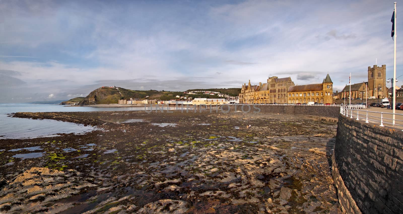A view at low tide of Aberystwyth, which is a holiday resort in Wales UK.
