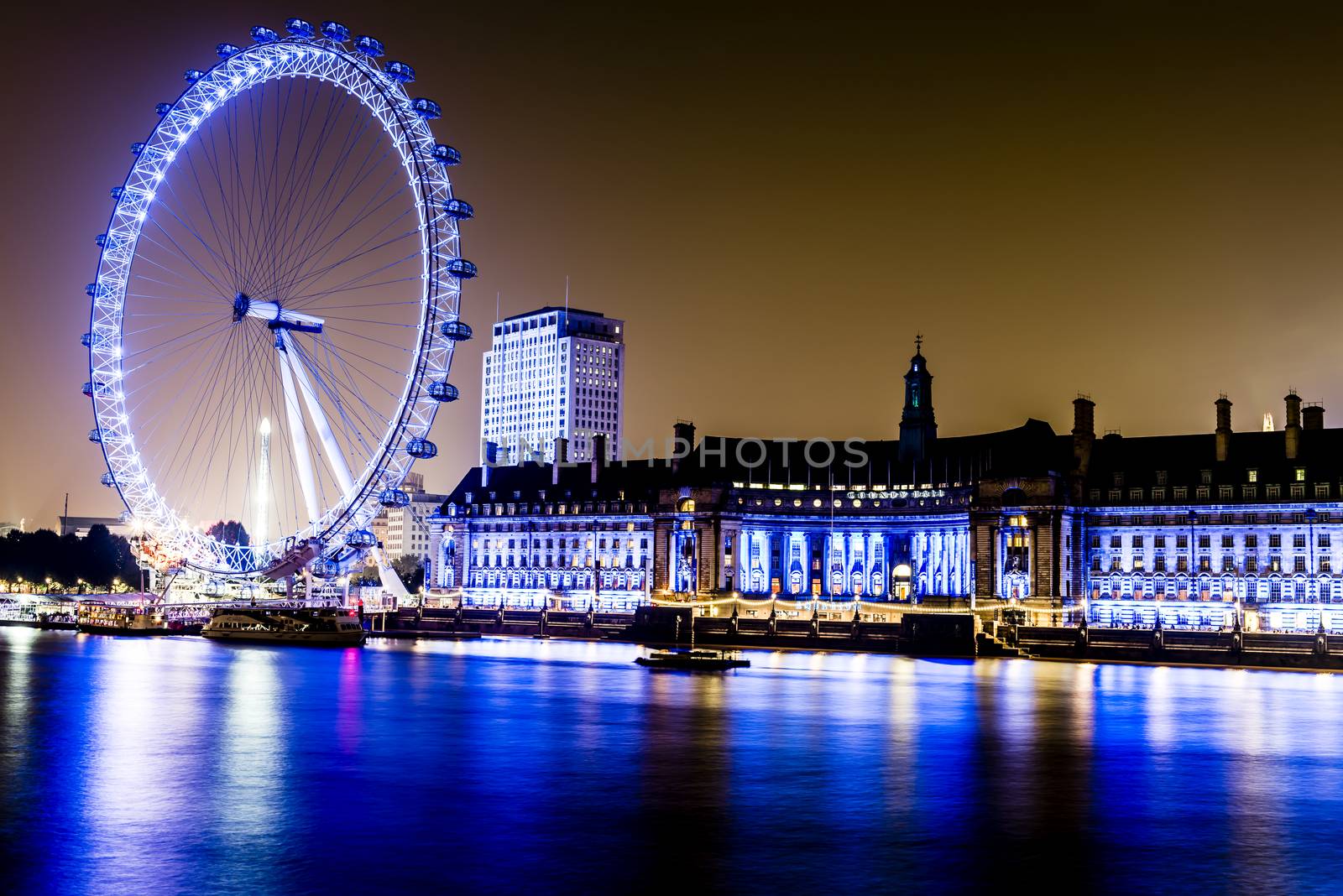 London at night along the River Thames by MohanaAntonMeryl