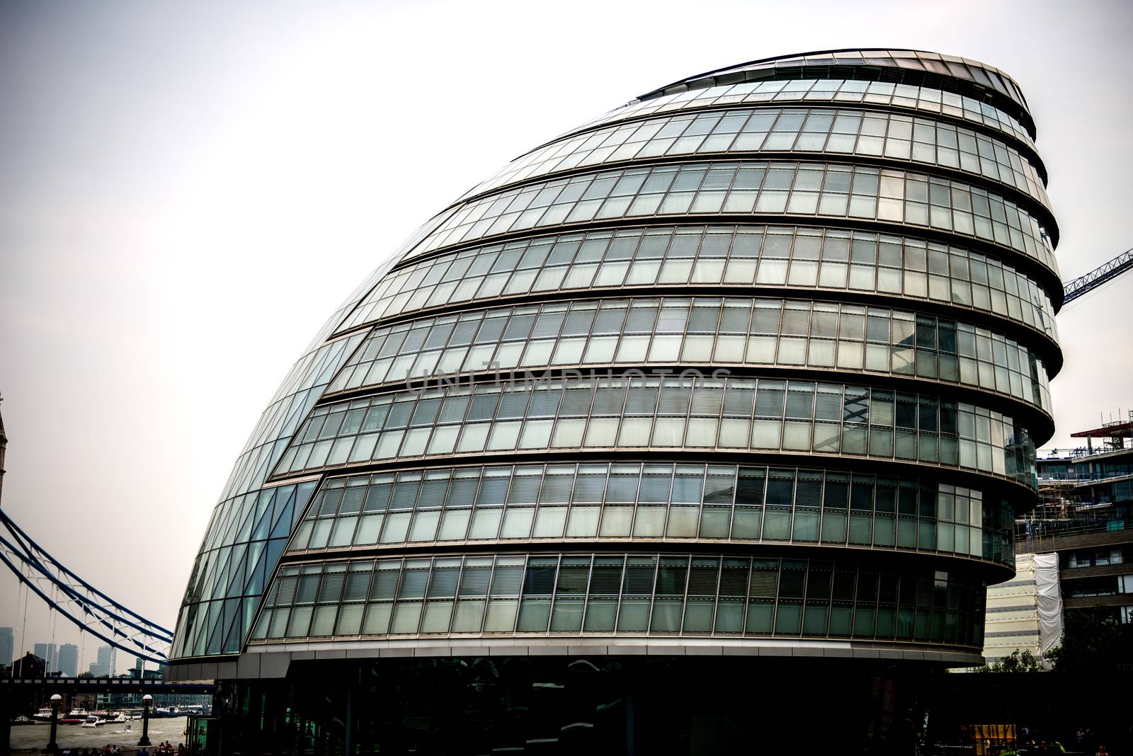 City Hall is the headquarters of the Greater London Authority (GLA), which comprises the Mayor of London and the London Assembly. Located in Southwark, on the south bank of the River Thames near Tower Bridge.

The building has an unusual, bulbous shape, intended to reduce its surface area and thus improve energy efficiency, although the excess energy consumption caused by the exclusive use of glass (in a double facade) overwhelms the benefit of shape.

Photographed using Nikon-D800E (36 megapixels) DSLR with AF-S NIKKOR 24-70 mm f/2.8G ED lens at focal length 48 mm, ISO 100, and exposure 1/1600 sec at f/2.8.