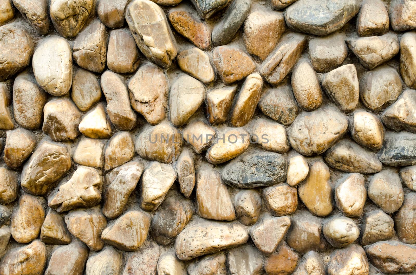 Stone wall Texture of different forms stones similar to wall by nopparats