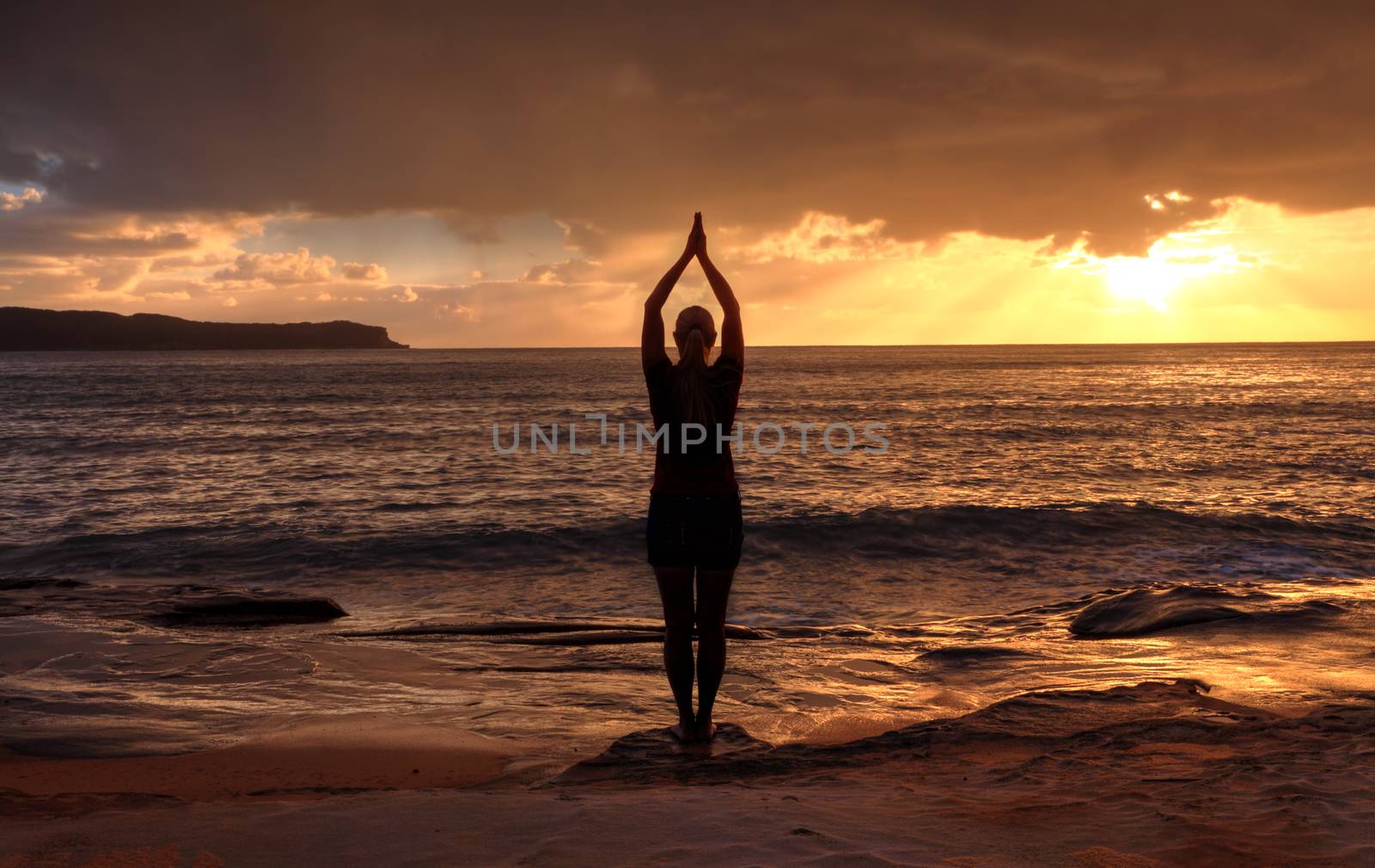 Woman Tadasana  -  Mountain Pose  yoga by the sea at sunrise by lovleah