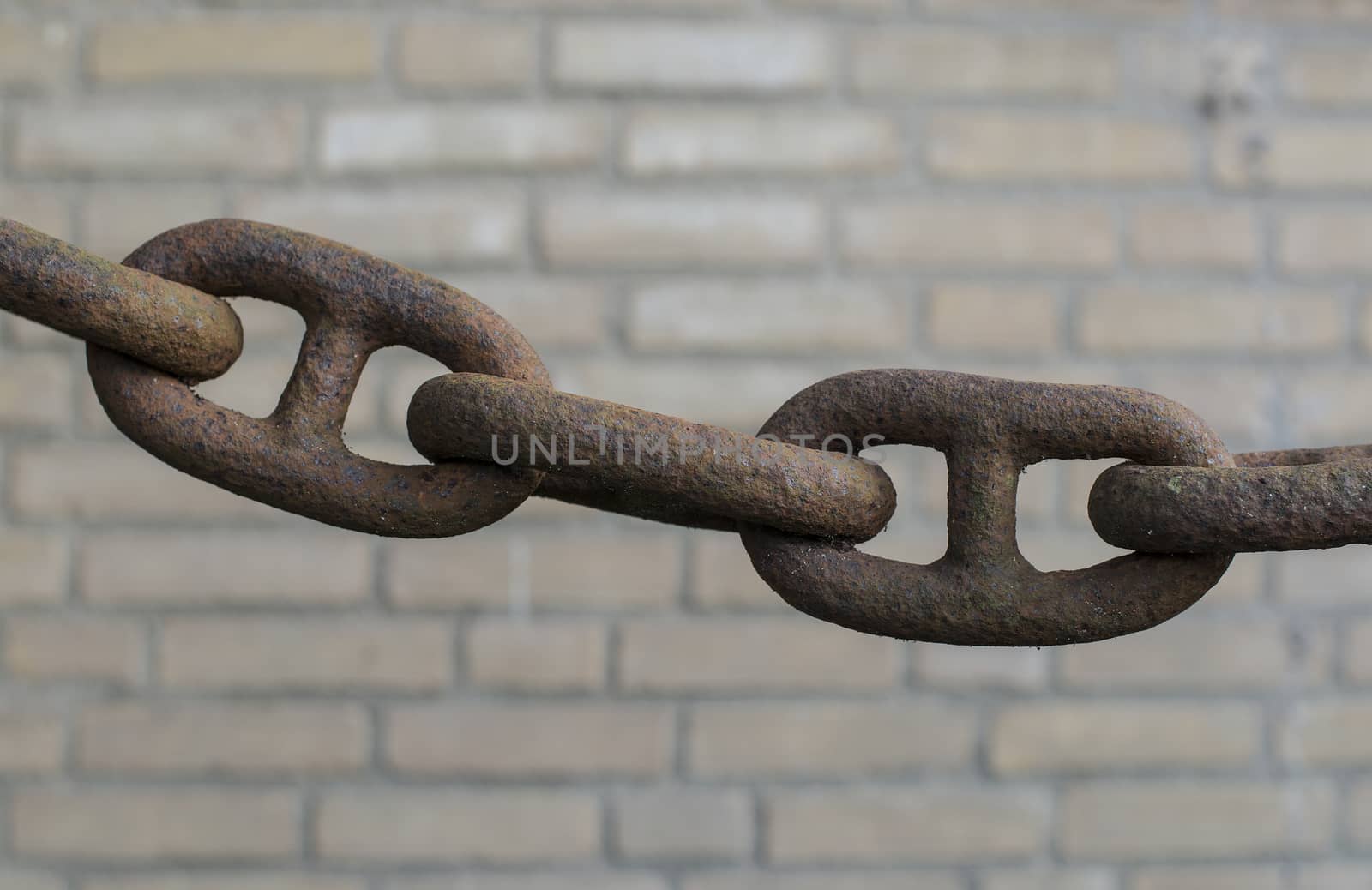 old rusted chain connections on blurry background