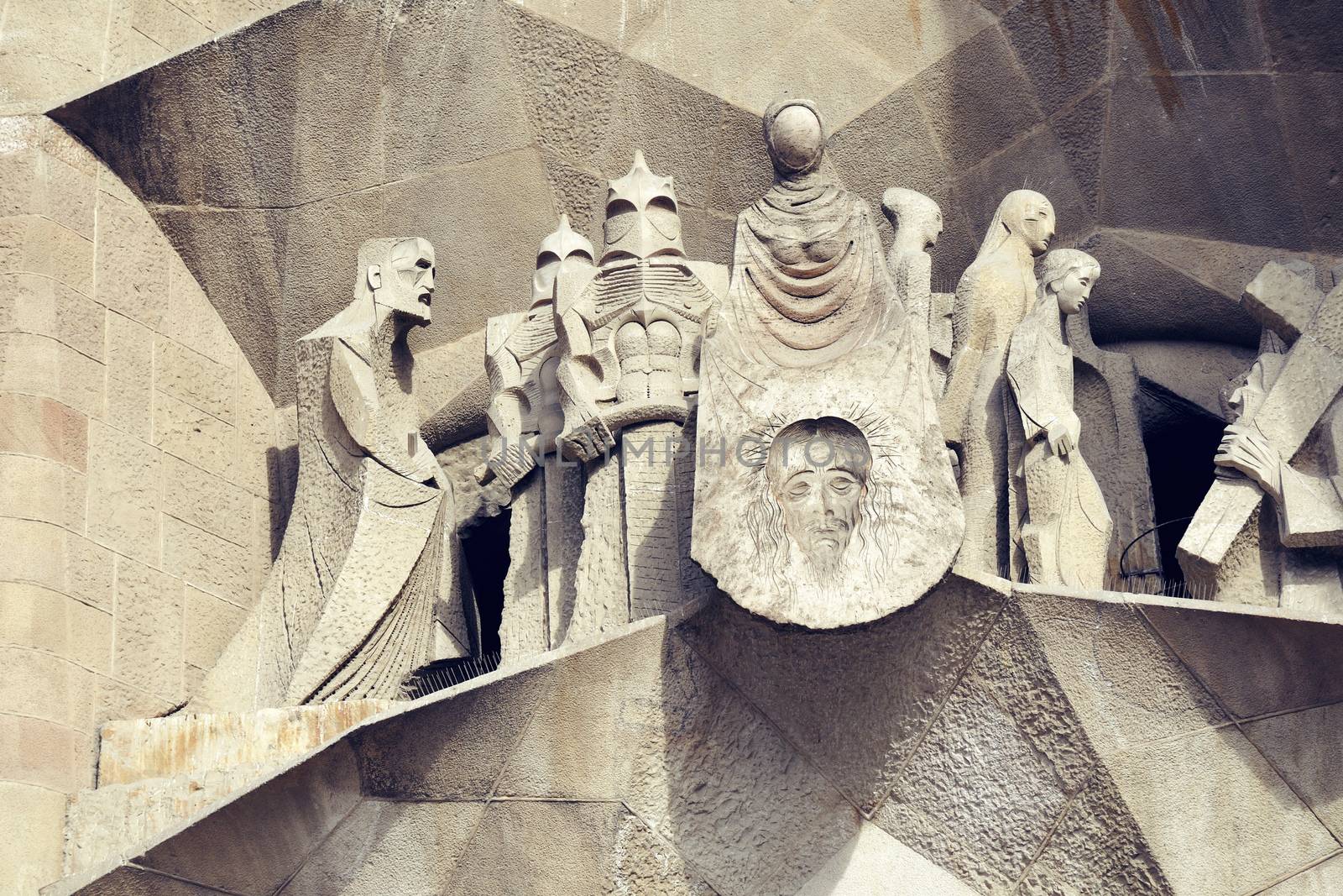 highly detailed sculptures scene over the Passion Facade entrance to the famous Barcelona landmark - Sagrada Familia Temple