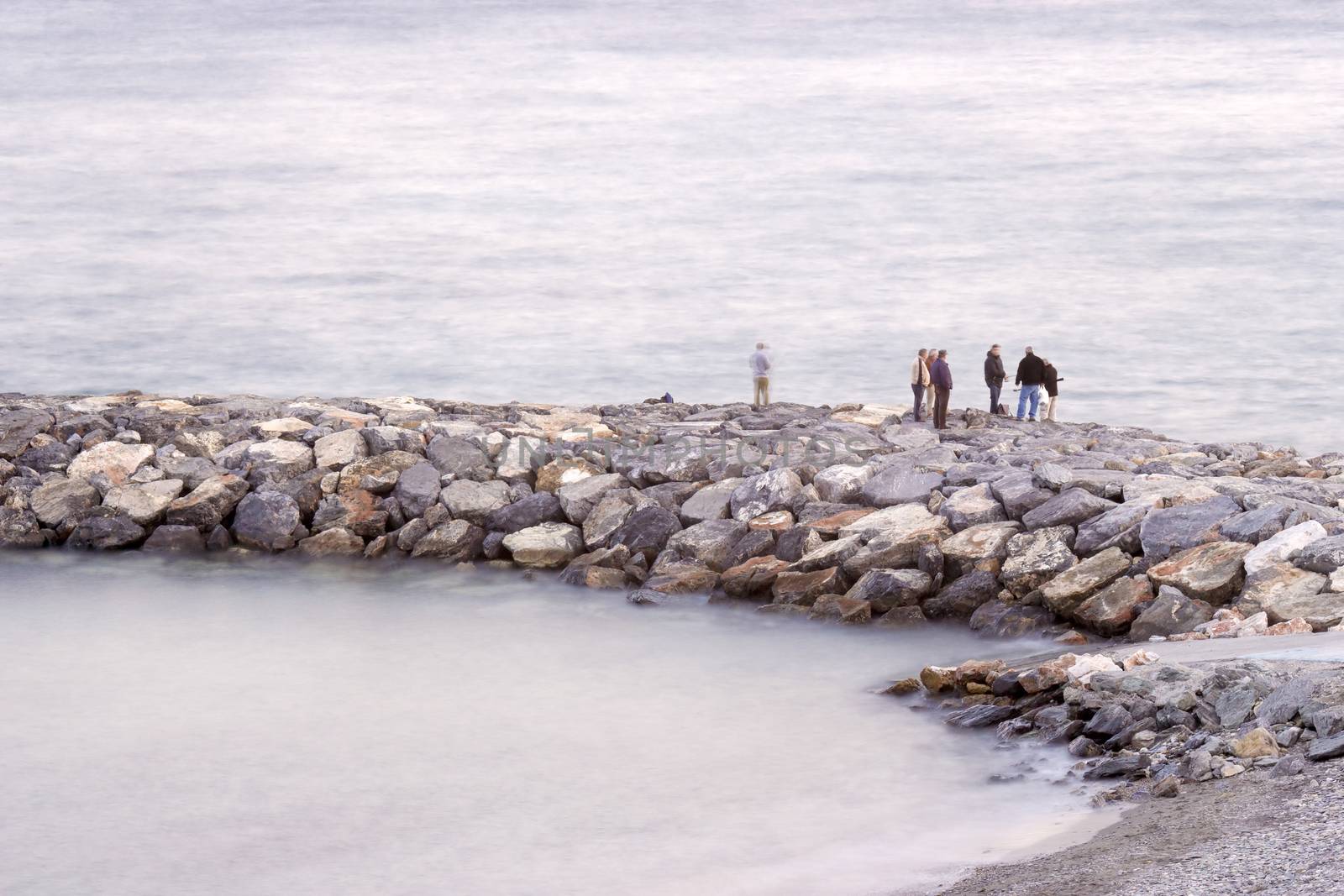 Fisher men on the stone groyne