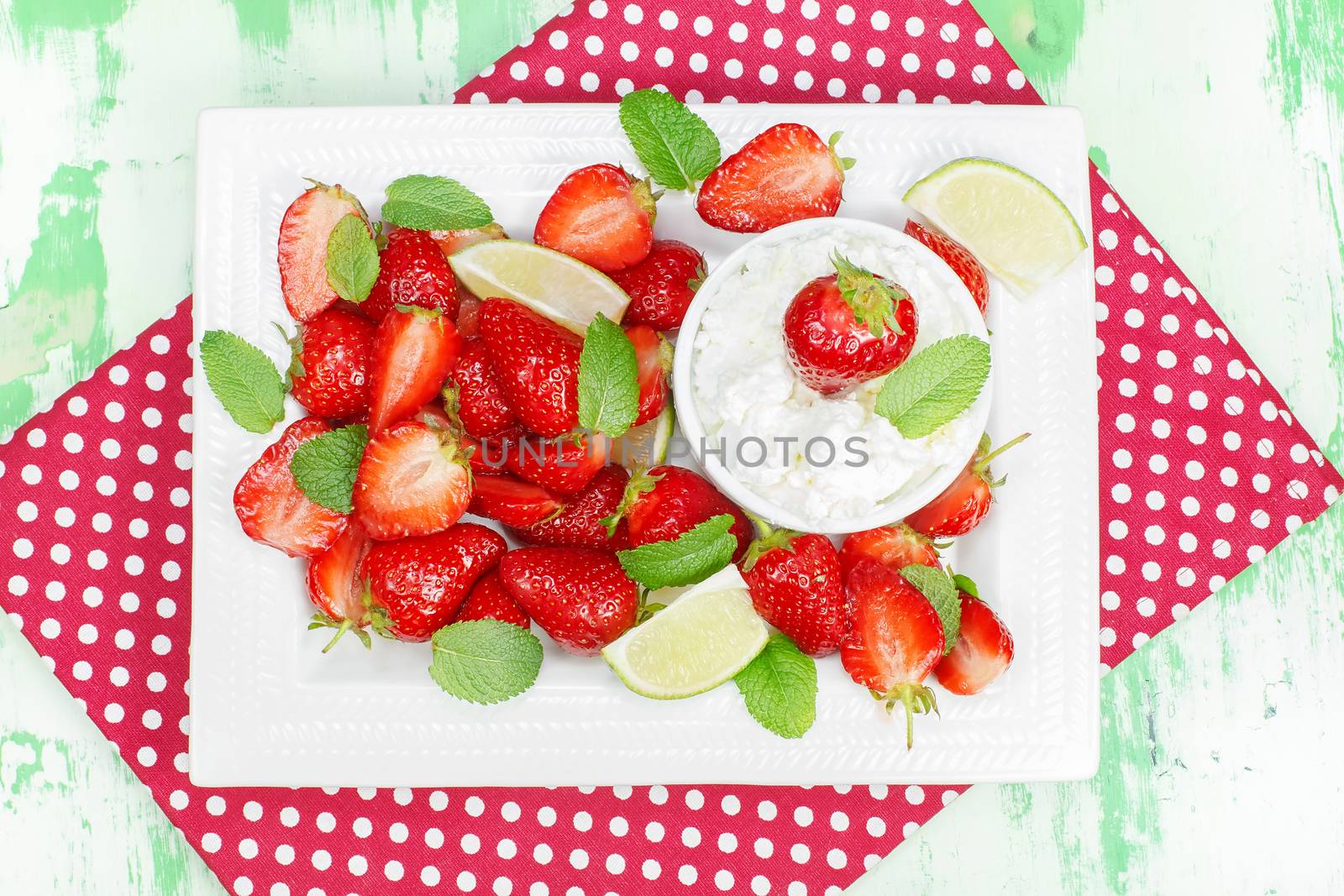 Macerated strawberries with mascarpone whipped cream and mint