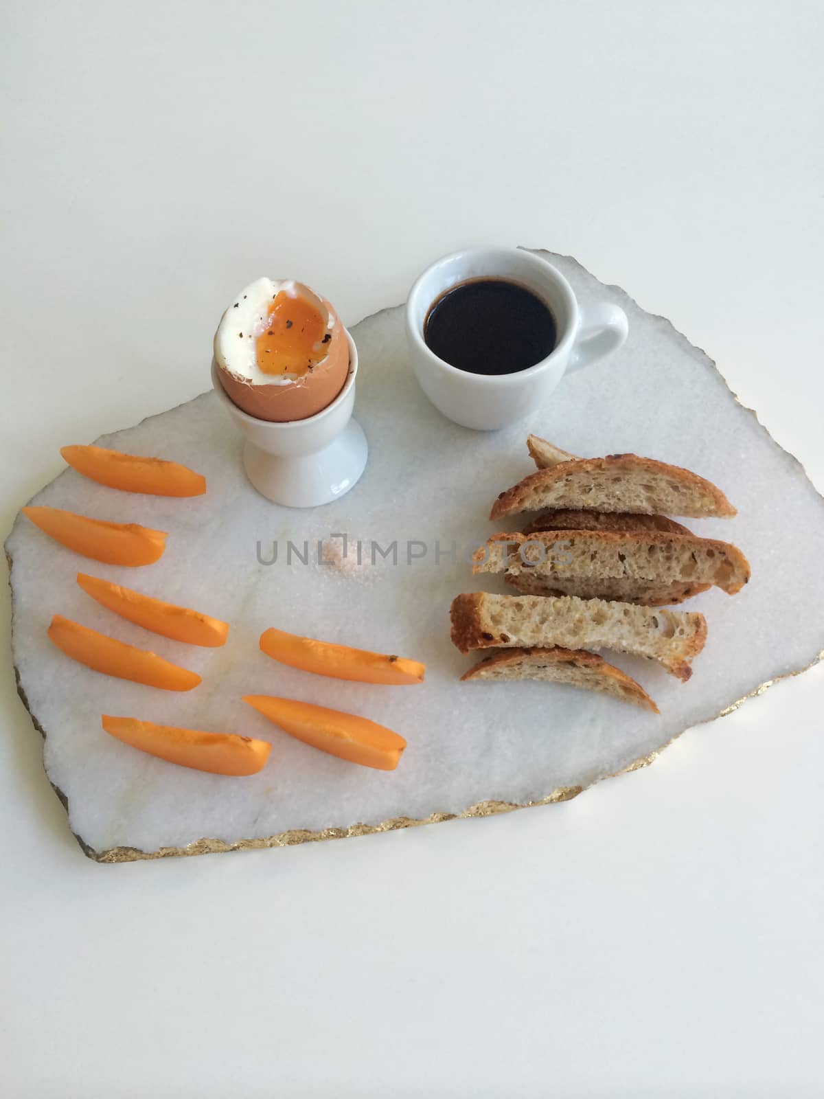 Soft boiled egg, toast and fruit breakfast