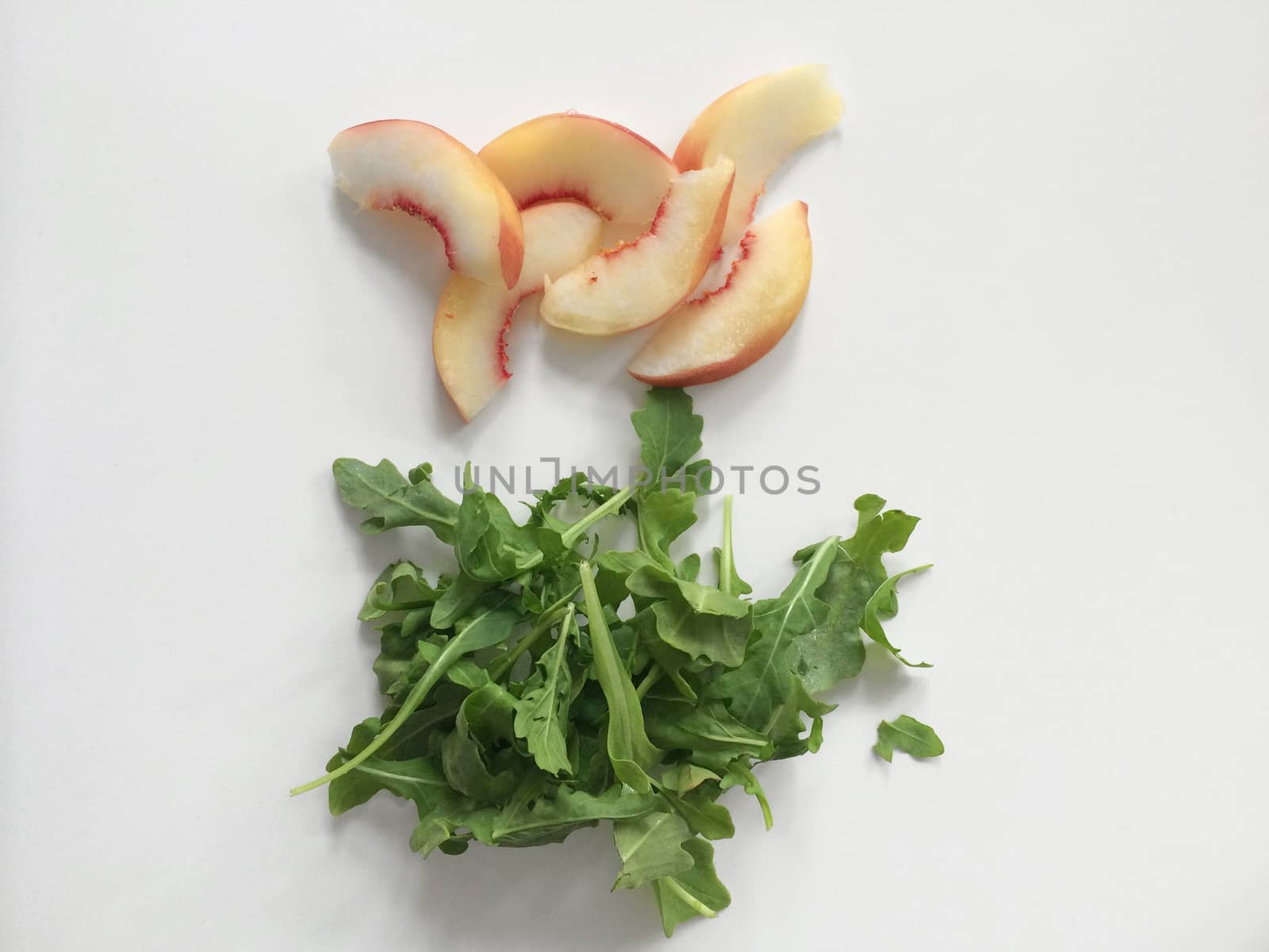 White peach and green arugula salad