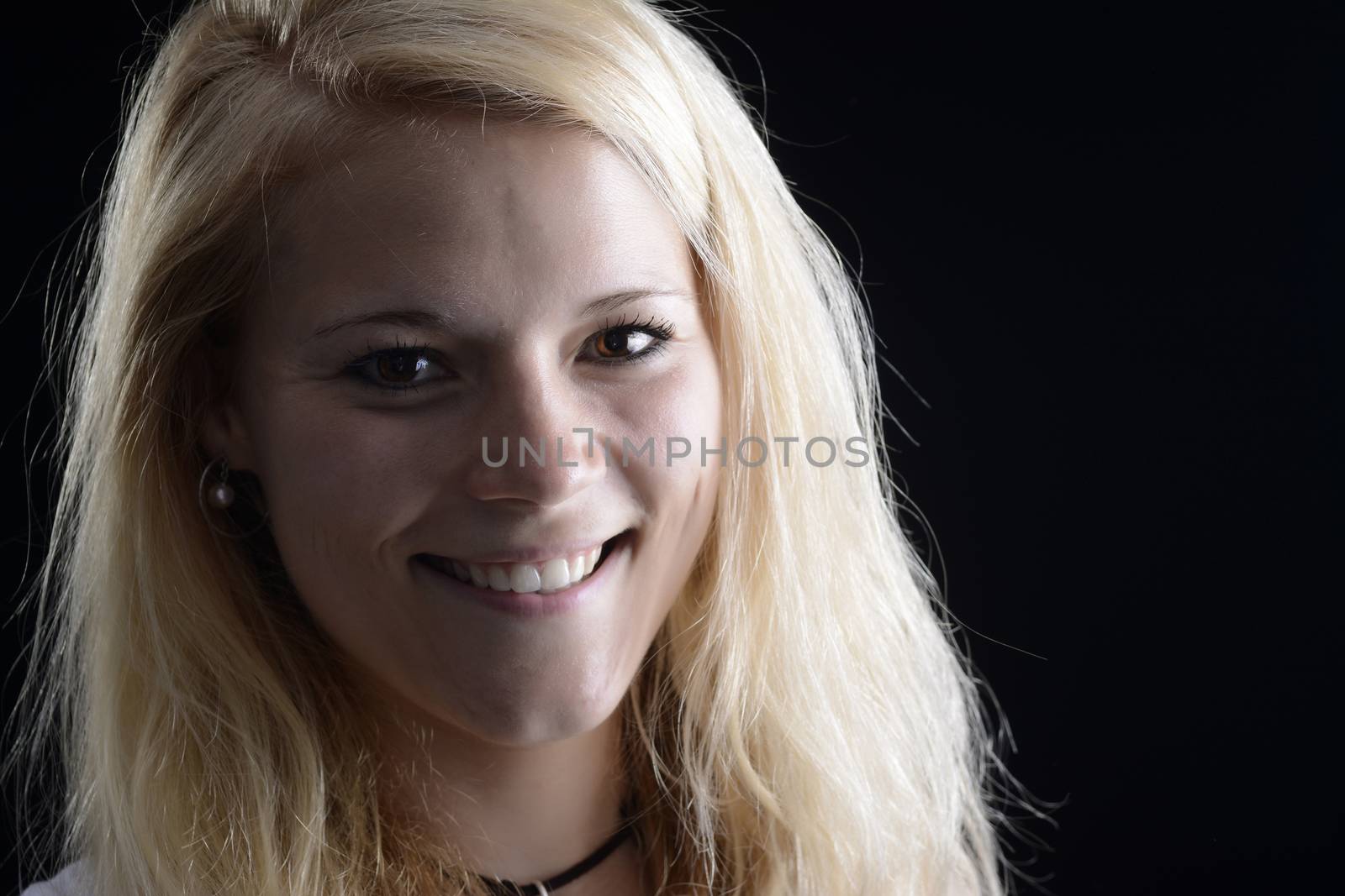pretty woman against black background