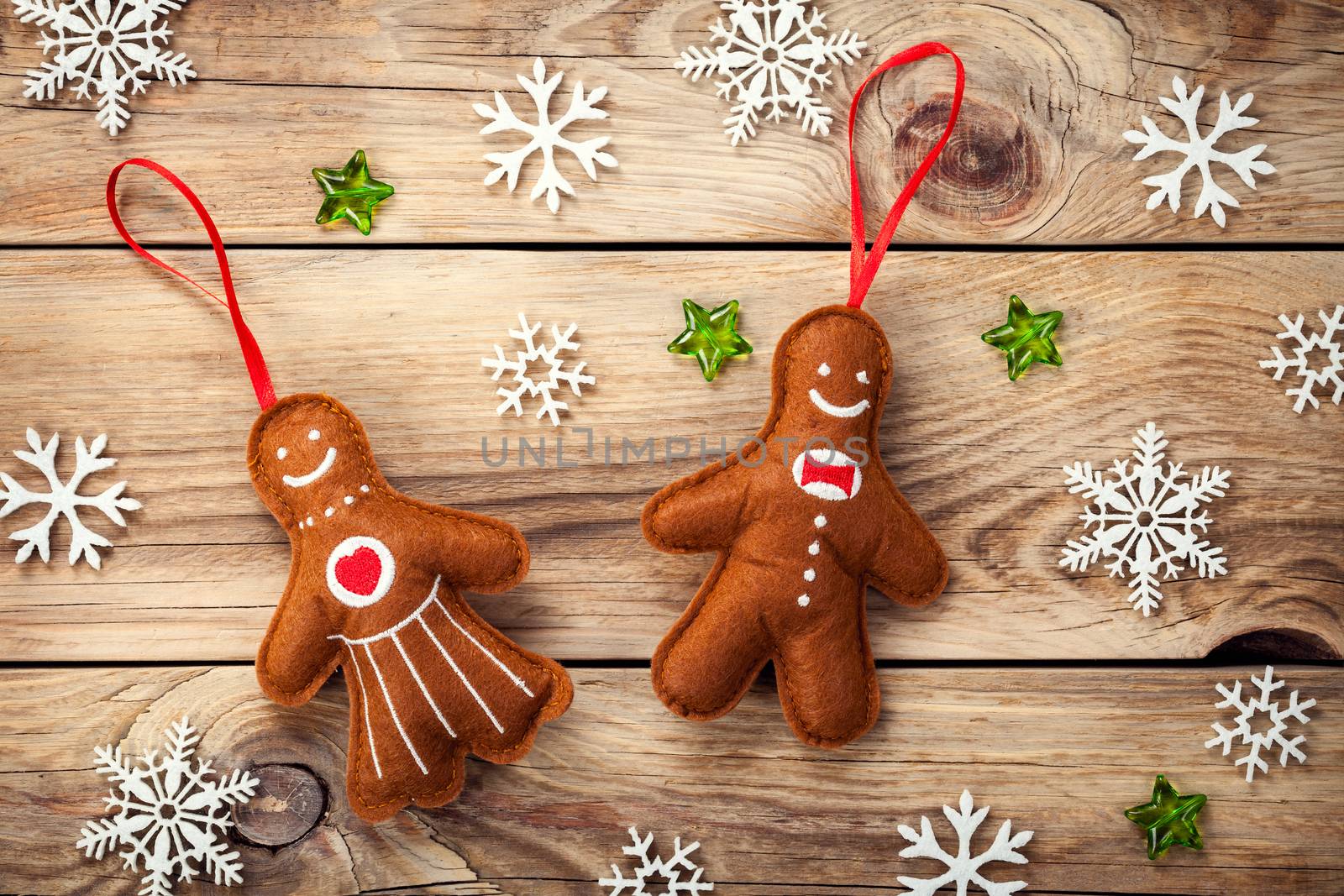 Christmas composition with gingerbread man and woman on wooden table. Top view