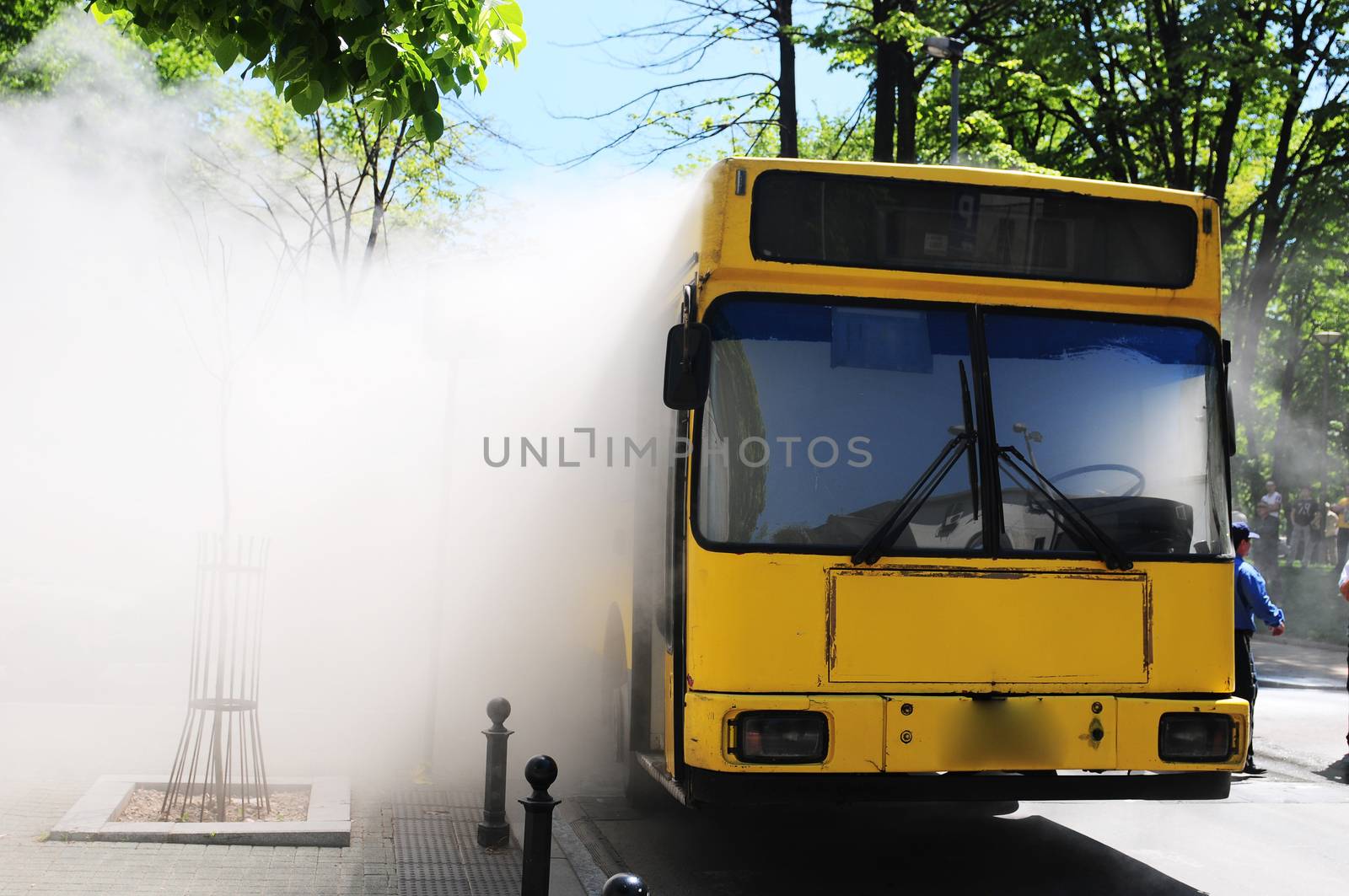 SERBIA, BELGRADE - APRIL 27, 2012: Bus on fire on the street in the middle of the day. More than have of the busses in Belgrade are older than 10 years