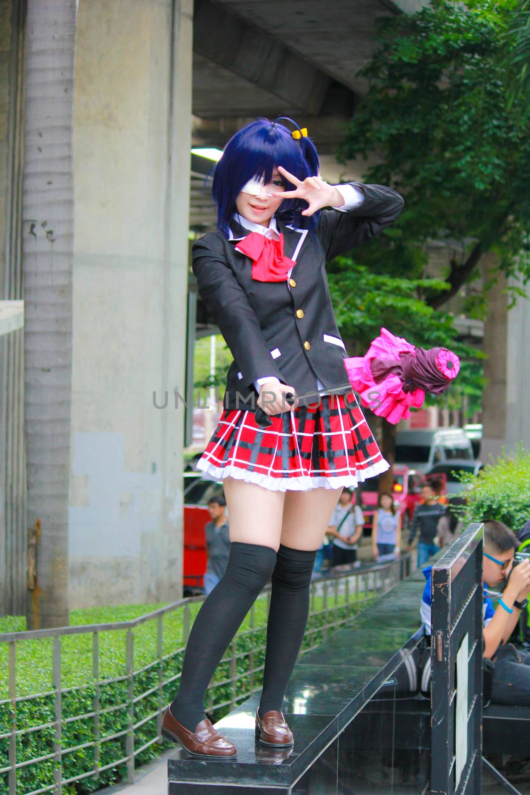 Bangkok - Aug 31: An unidentified Japanese anime cosplay Takanashi Rikka pose  on August 31, 2014 at Central World, Bangkok, Thailand.
