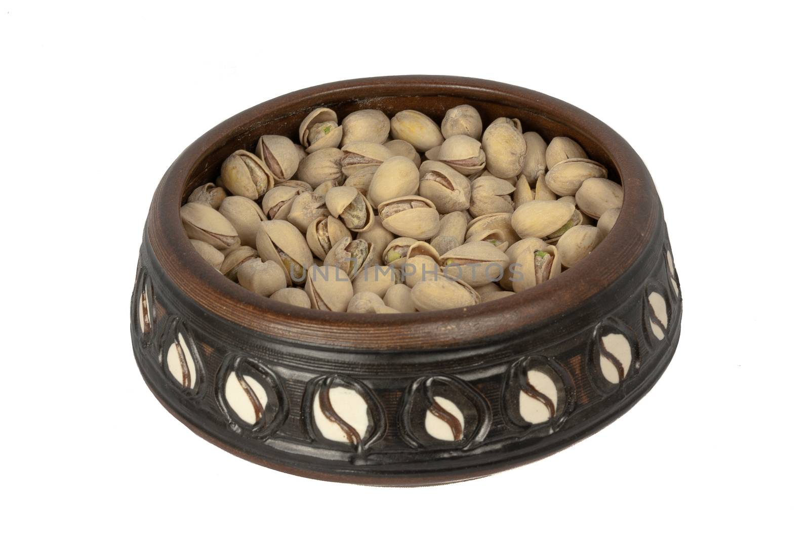 A Bowl Of Pistachios Isolated On A White Background