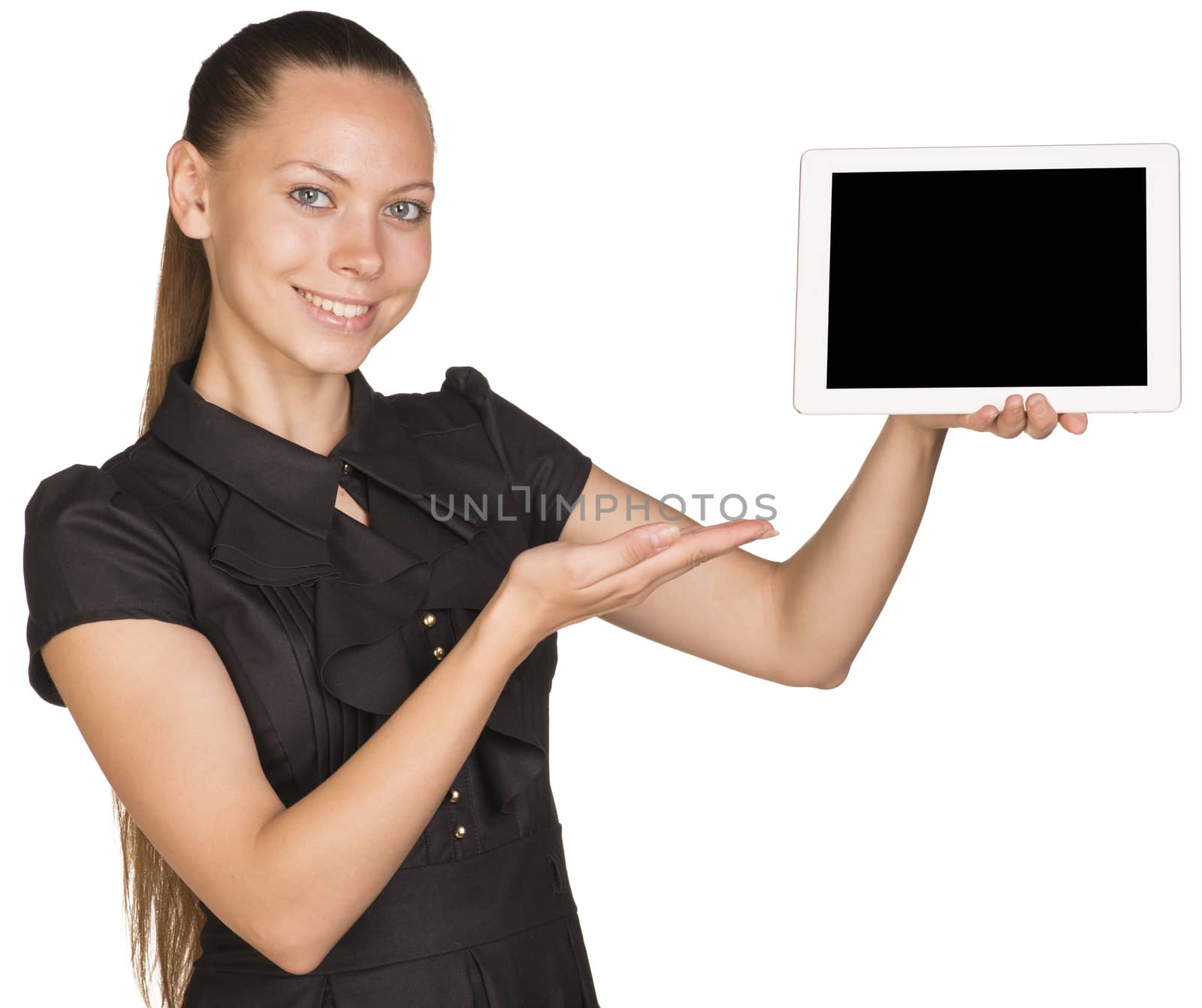 Beautiful girl in dress holding tablet and pointing at it. Isolated on white background