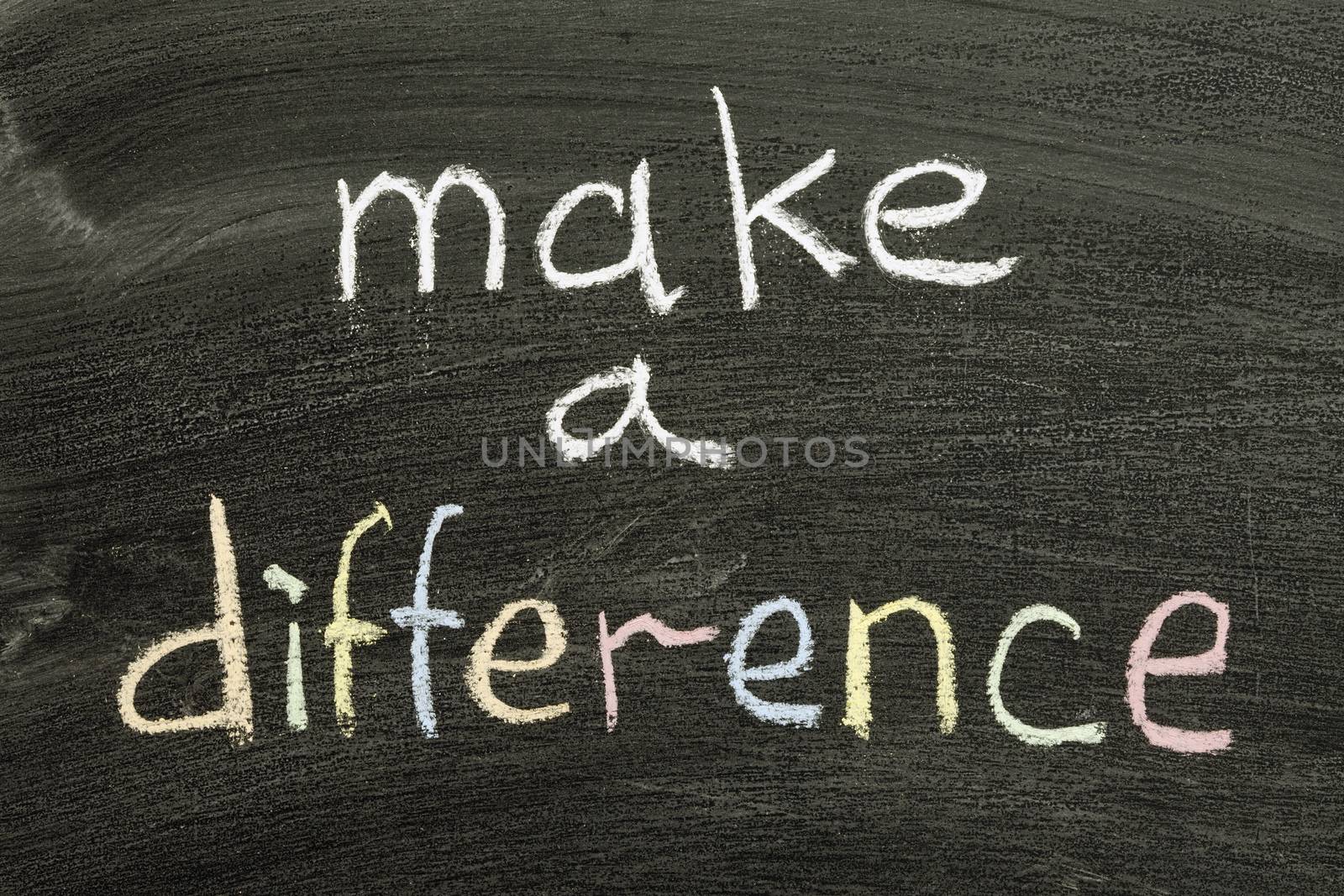 make a difference phrase handwritten on blackboard