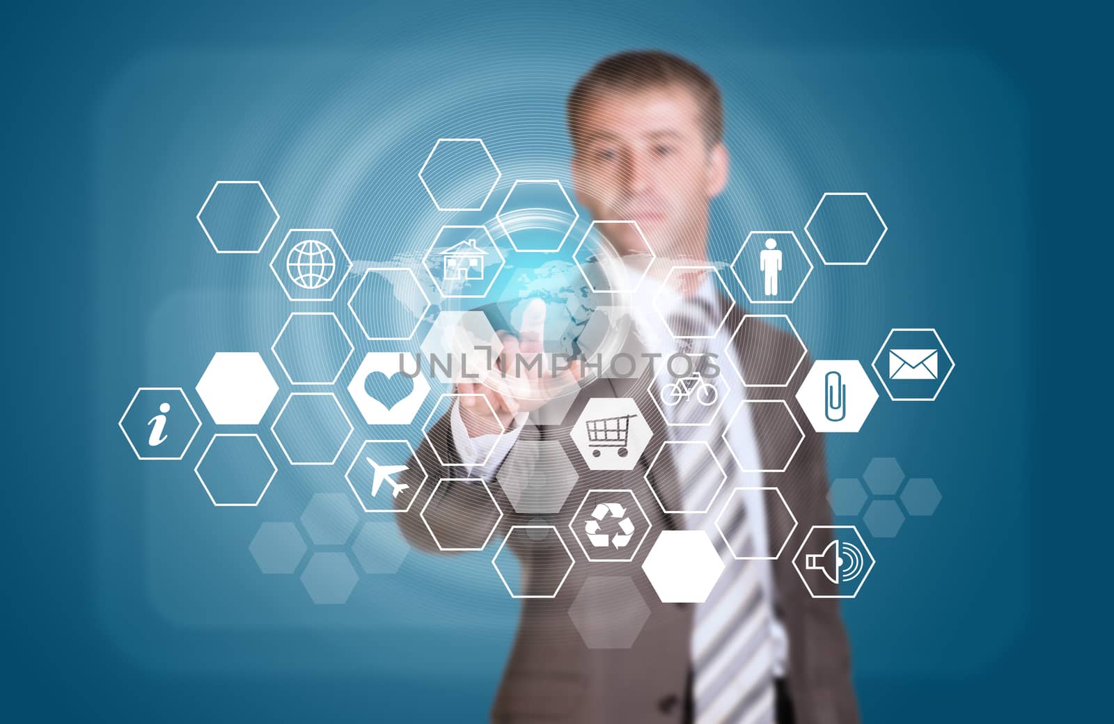 Businessman in suit finger presses virtual button. Hexagons with icons and world map