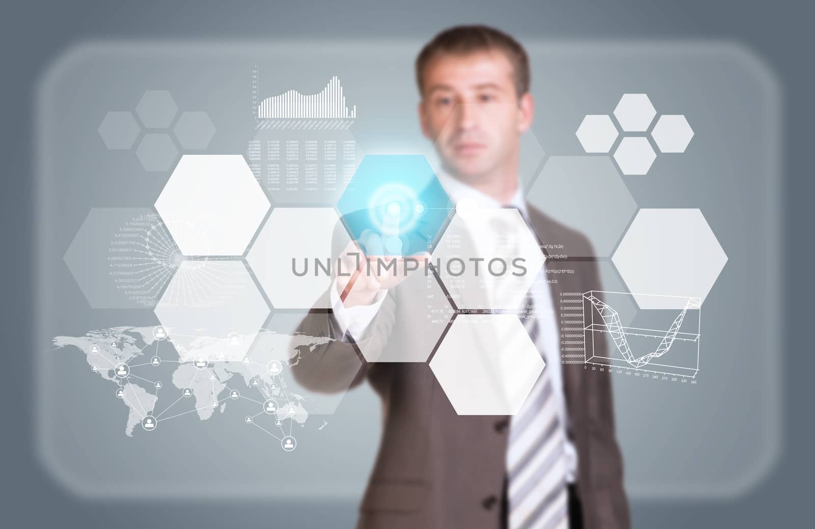 Businessman in suit finger presses virtual button. Graphs, world map, network and other elements as backdrop