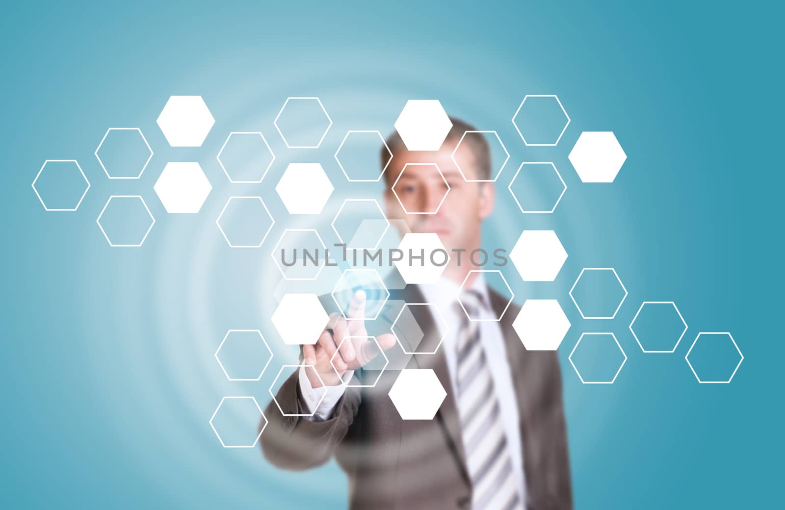 Businessman in suit finger presses virtual button. Transparent hexagons and glow circles as backdrop