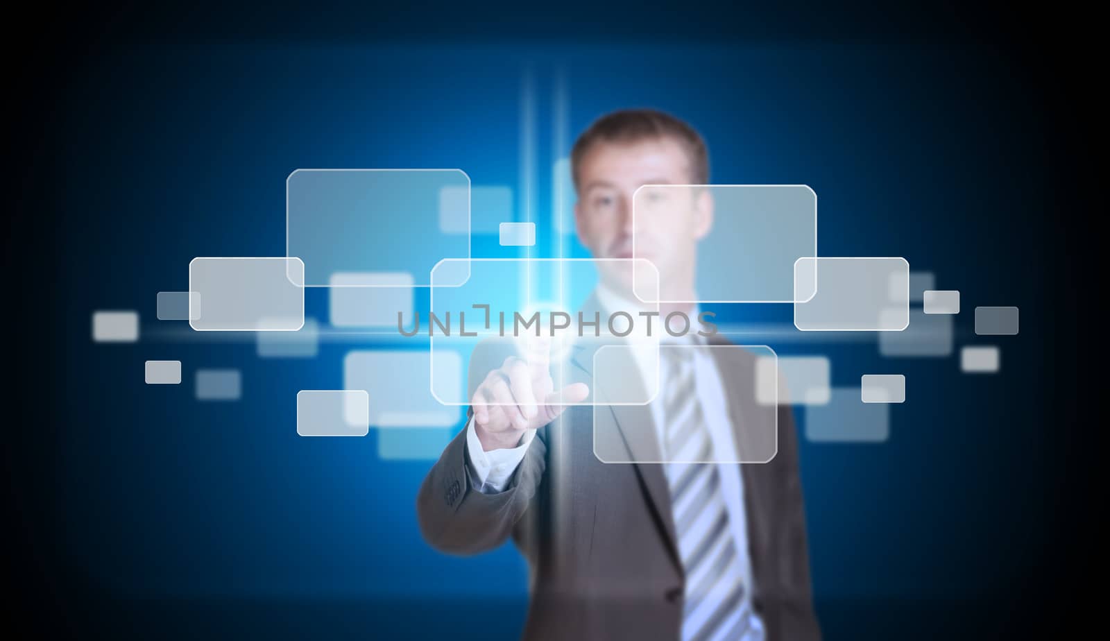 Businessman in suit finger presses virtual button. Blue background