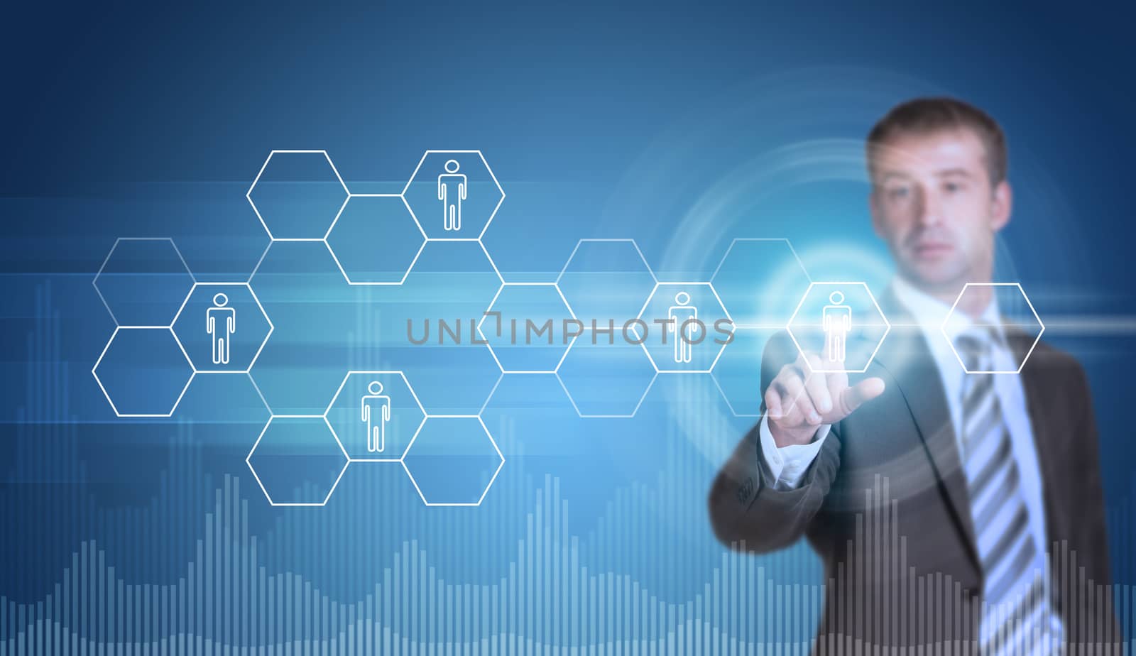 Businessman in suit finger presses virtual button. Transparent hexagons, glow circles and graphs as backdrop