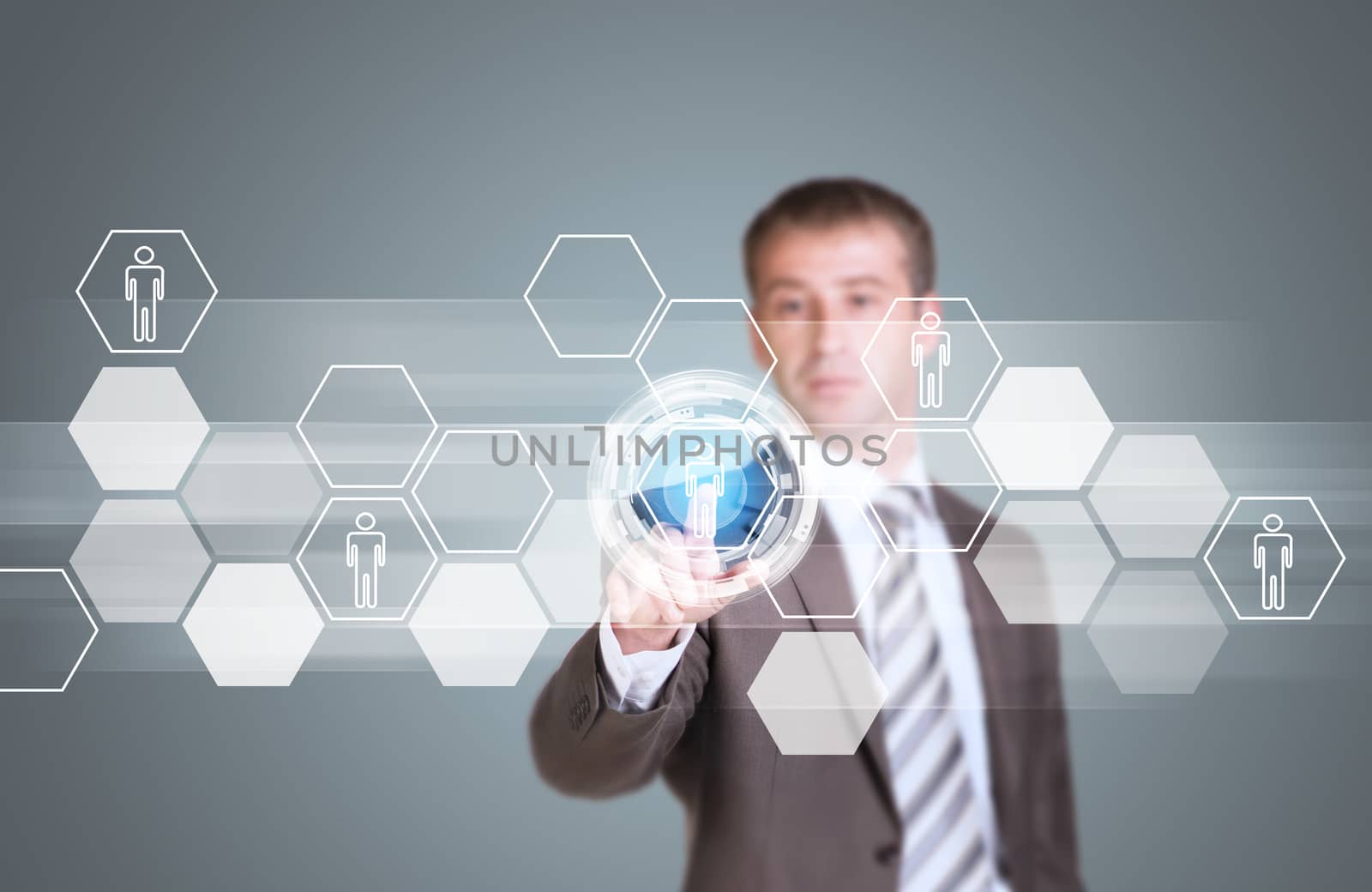 Businessman in suit finger presses virtual button. Transparent hexagons, glow circles and other elements as backdrop