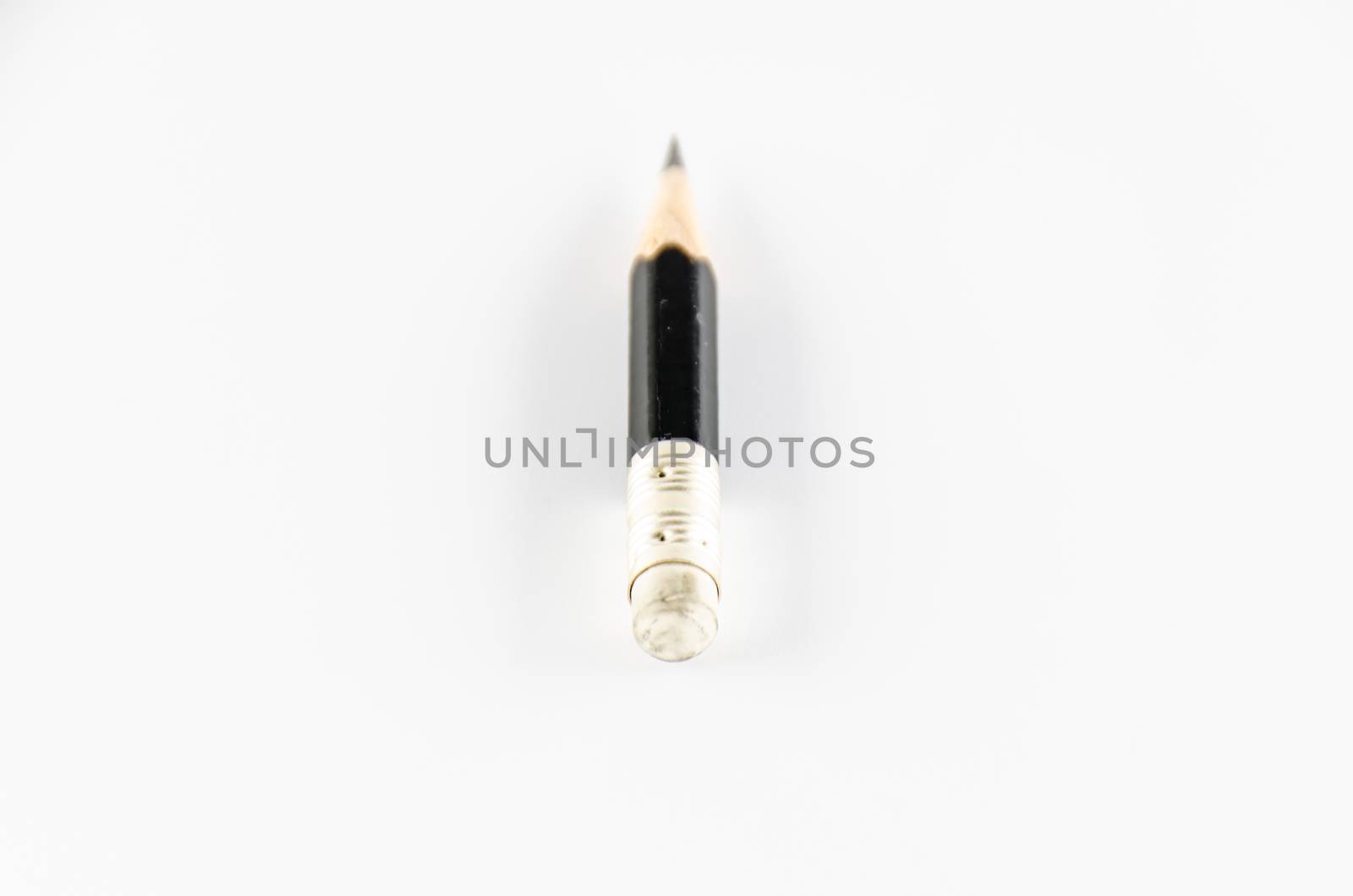 short black pencil on a white background