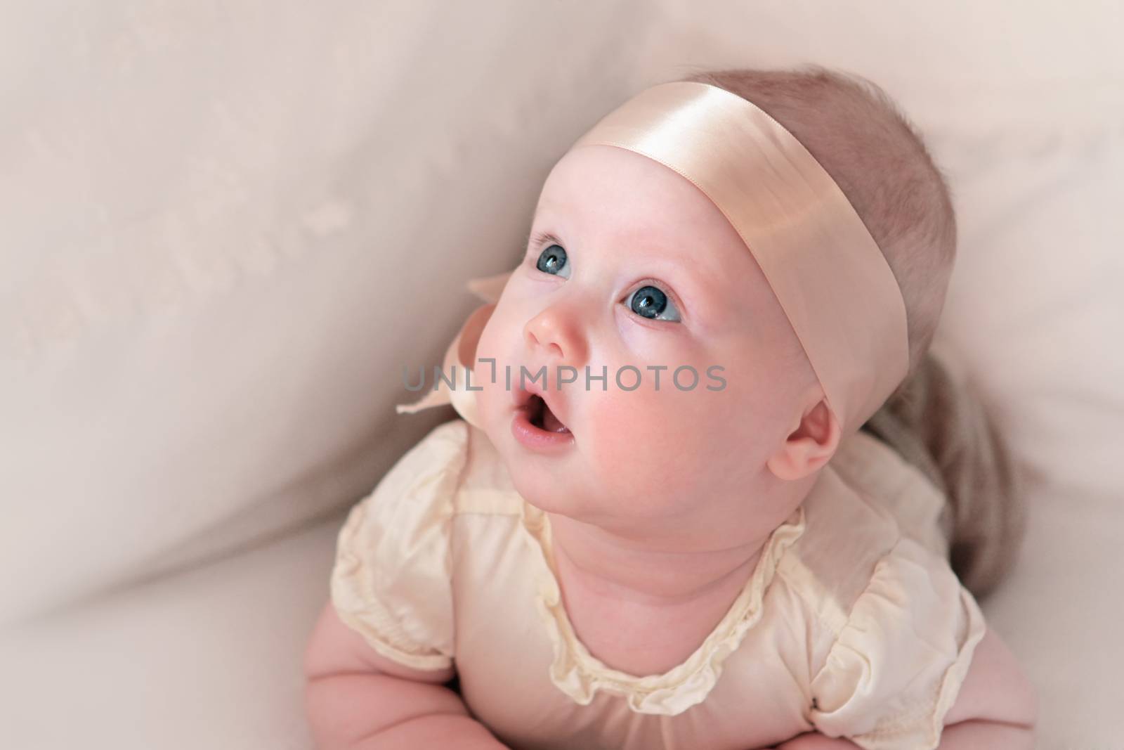 Beautiful small kid girl in pink tone