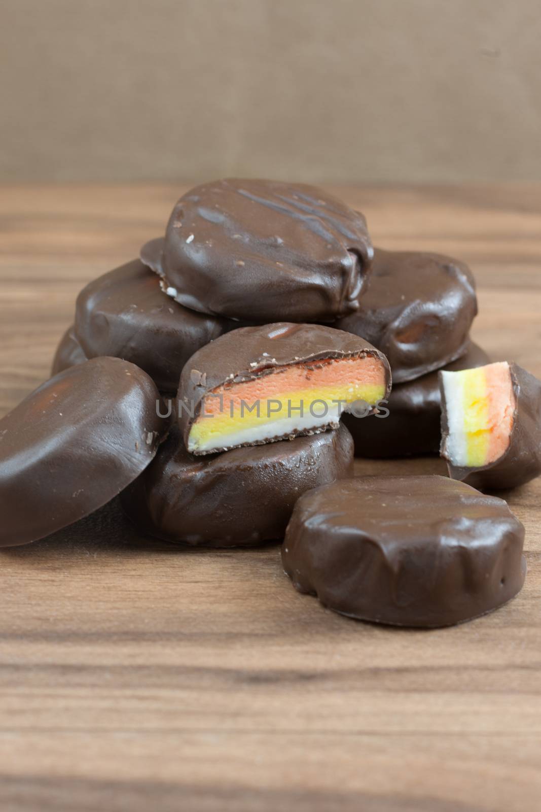 Peppermint patties filled with white, yellow, and orange colored filling.