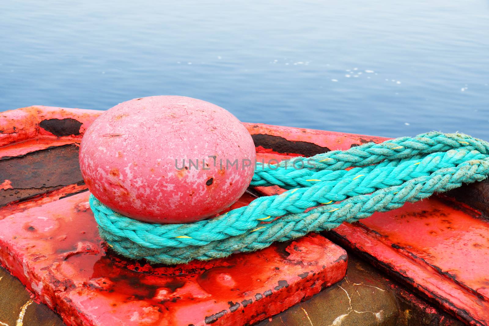 Sea concept : red mooring bollard for very large boat over ocean