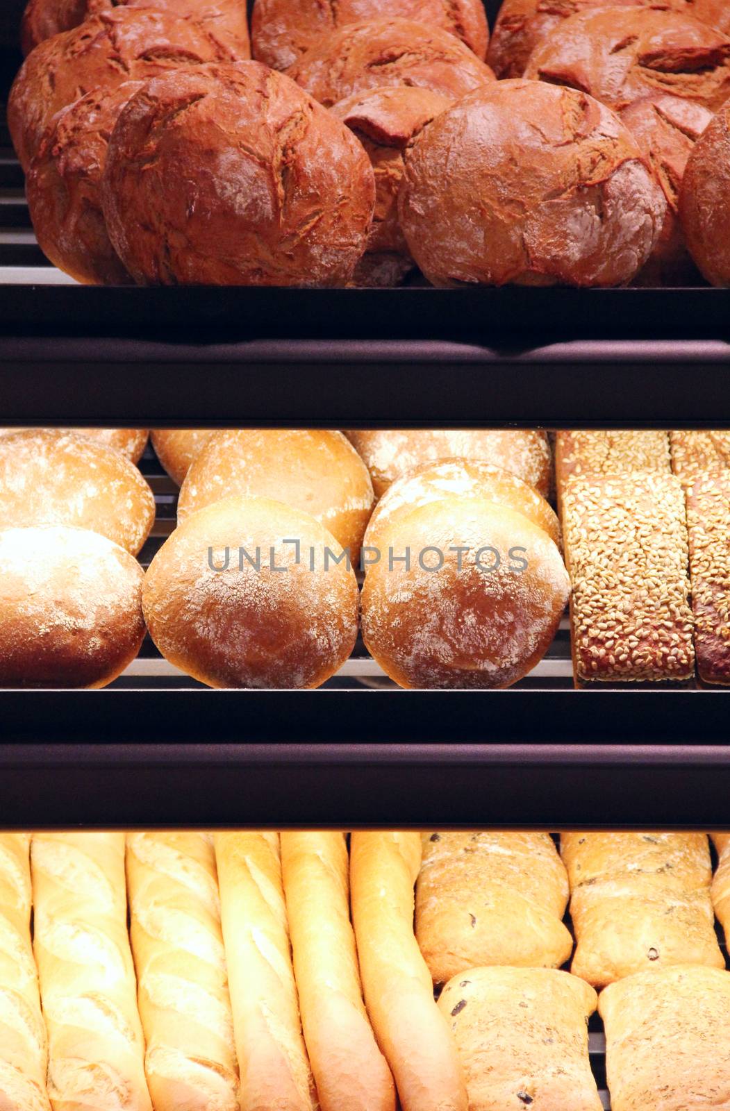 Bread on showcase in supermarket, close-up view
