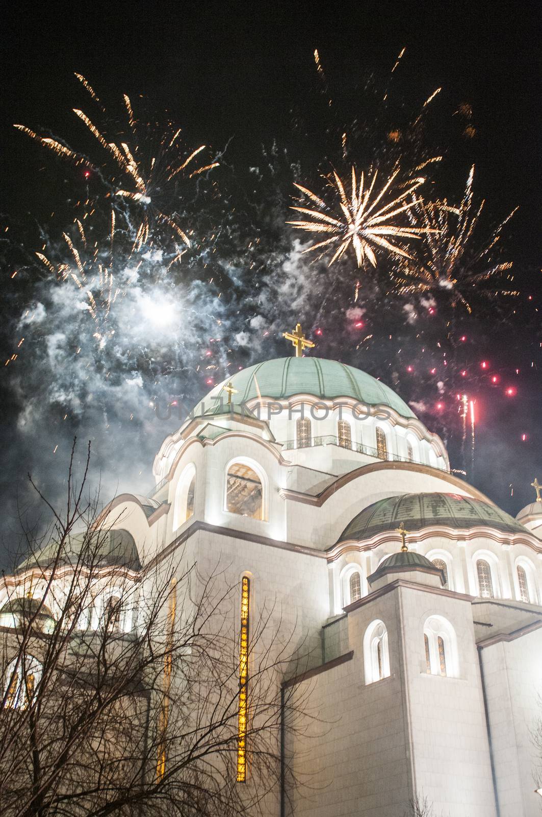 BELGRADE - JANUARY 13: Serbian New years eve celebration in front of the St. Sava's temple with fireworks at midnight in Belgrade, Serbia on January 13, 2013