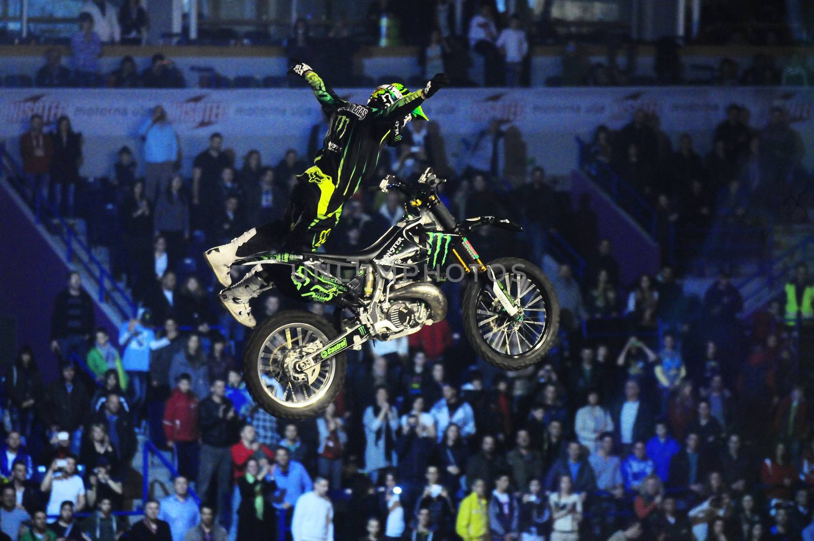 SERBIA, BELGRADE - APRIL 26, 2012: Bike rider performing the trick at Masters of dirt show, most thrilling and spectacular freestyle motocross show