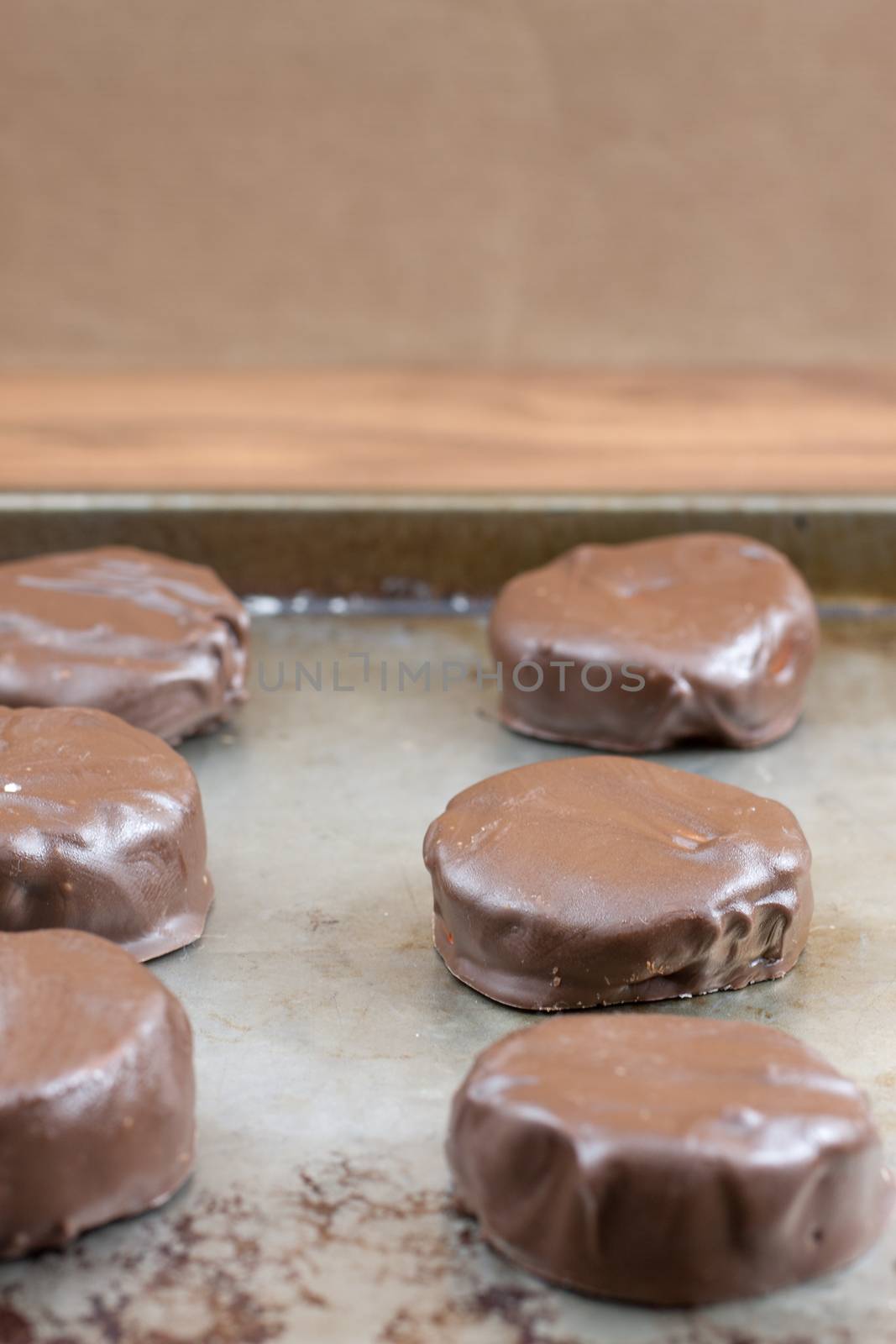 Peppermint patties filled with white, yellow, and orange colored filling.