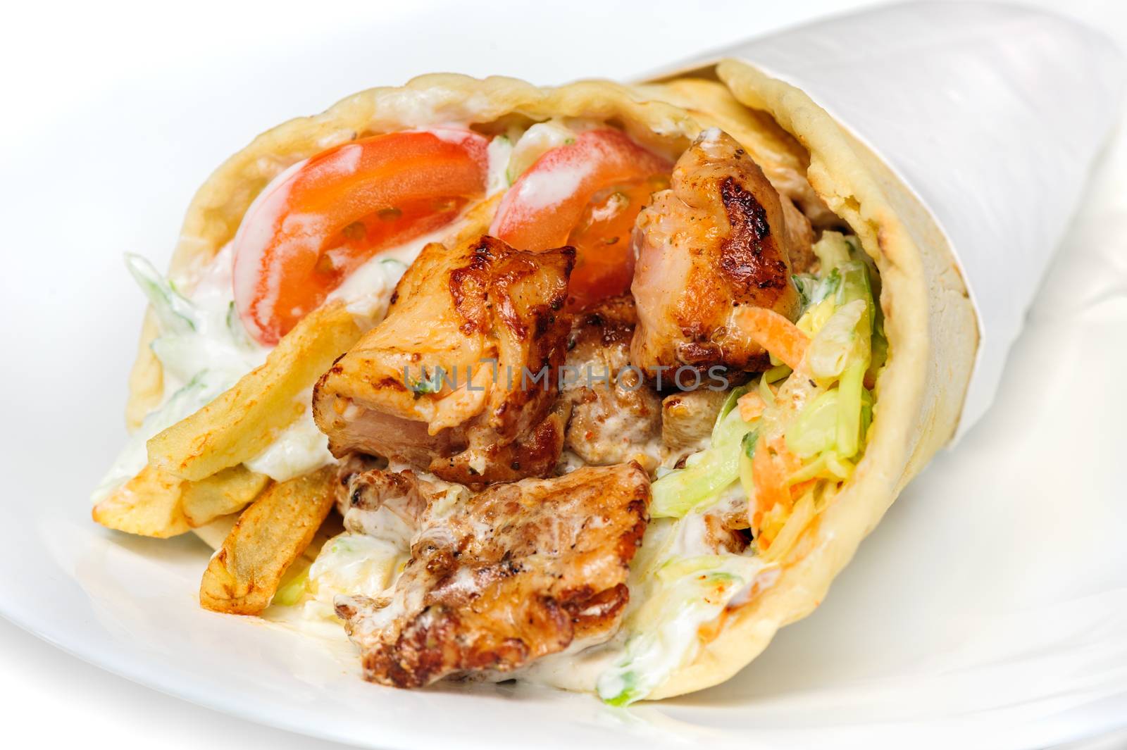 greek gyros stuffed with meat, salad, onion, tomato and potato