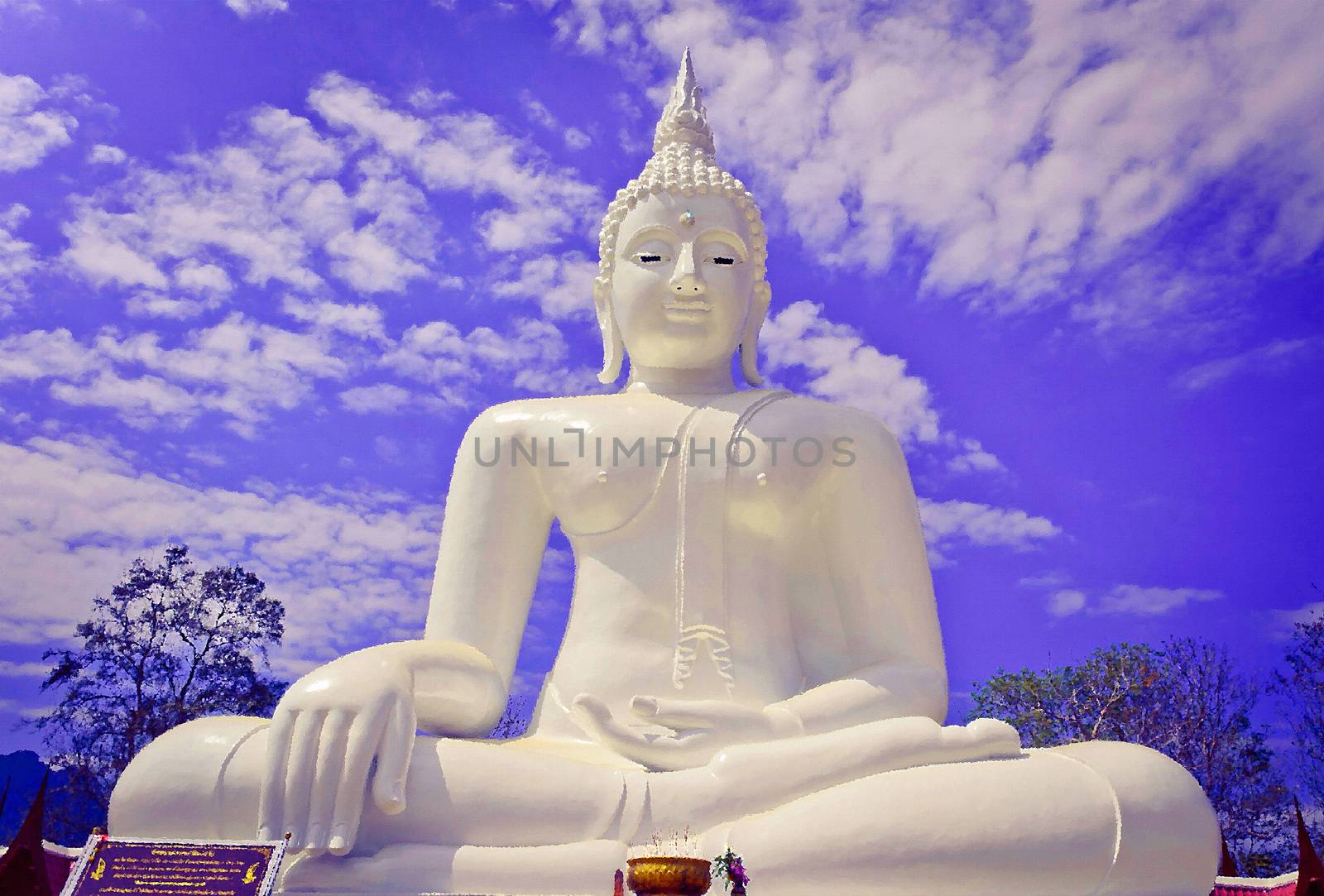 The white seated buddha image in Cloudy Blue Sky Background place at Wat Thatanon, Thongphapoom district, Kanchanaburi province, Thailand.