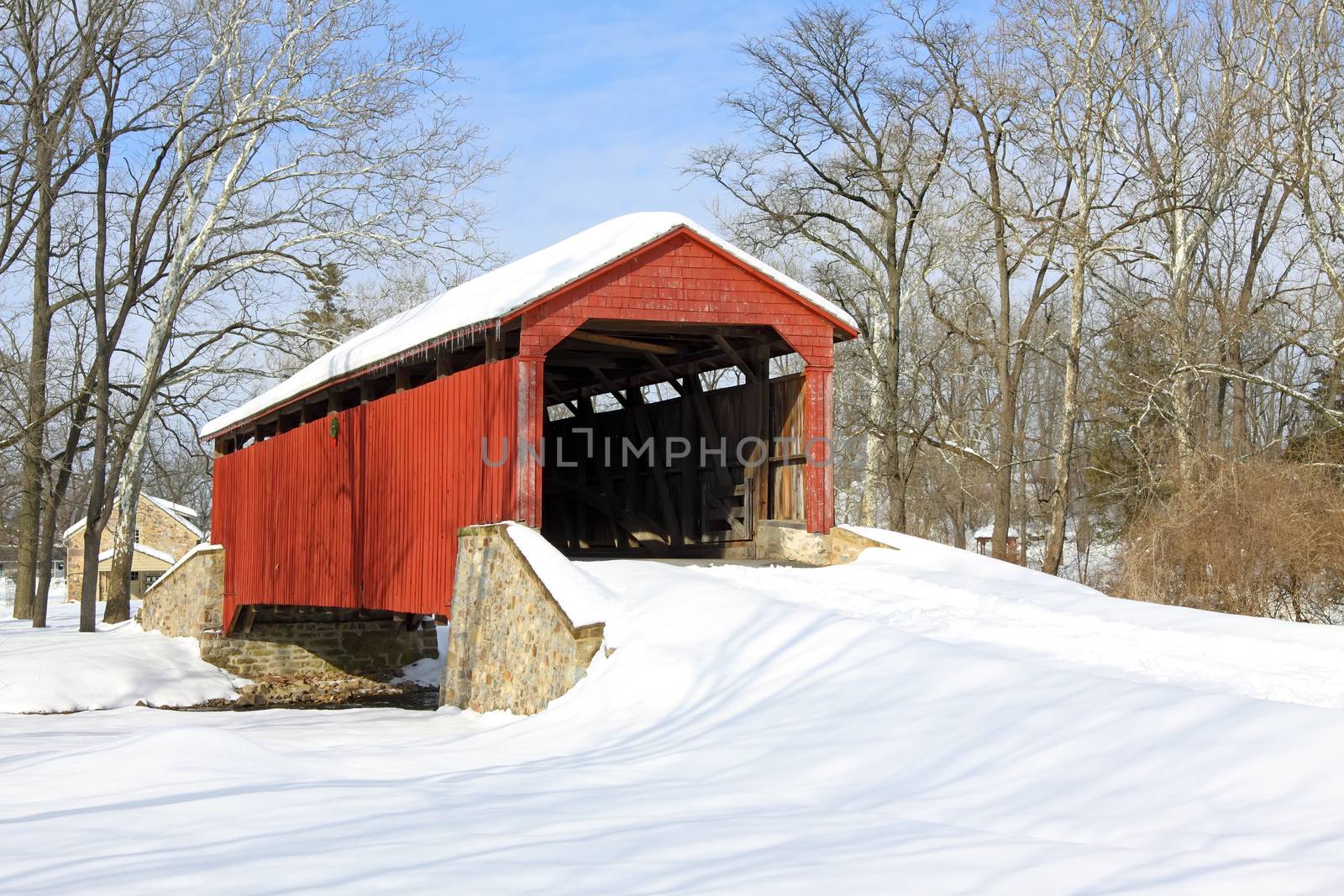 Pool Forge Covered Bridge with snow in Lancaster County, Pennsylvania, USA.