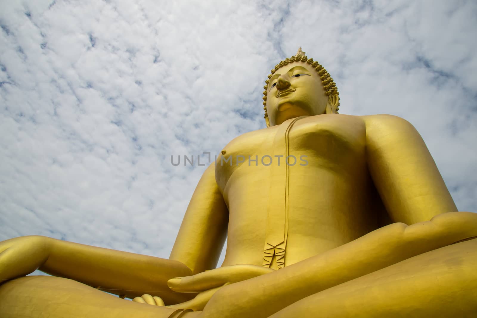 A big Buddha statue in the temple of Thailand.