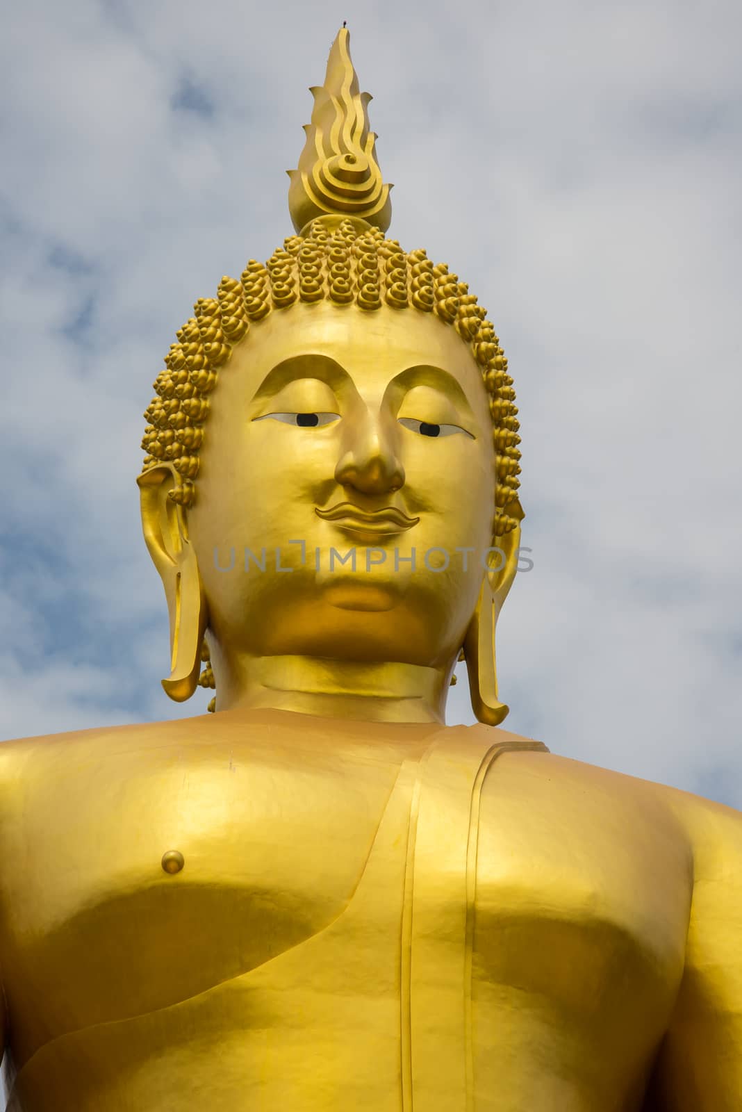 A big Buddha statue in the temple of Thailand.
