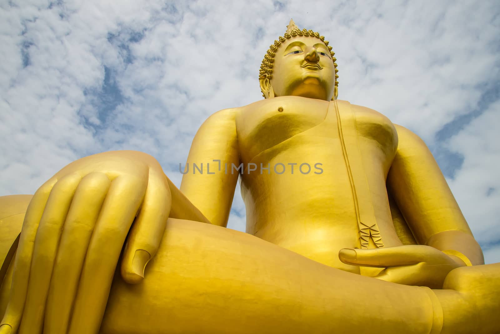 A big Buddha statue in the temple of Thailand.