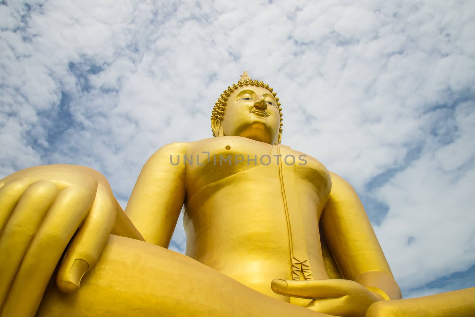 A big Buddha statue in the temple of Thailand.