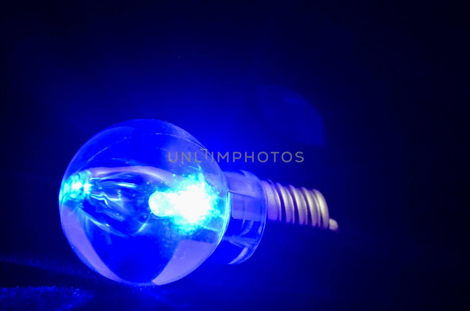 Photo of an Illuminated Light Bulb on Black Background